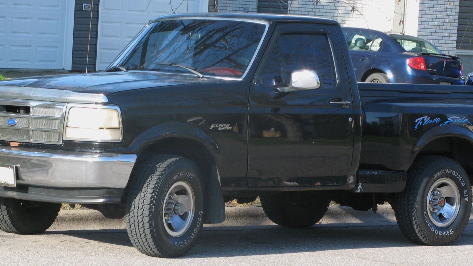 1993 Ford F-150 flareside pickup truck, front three-quarter left view