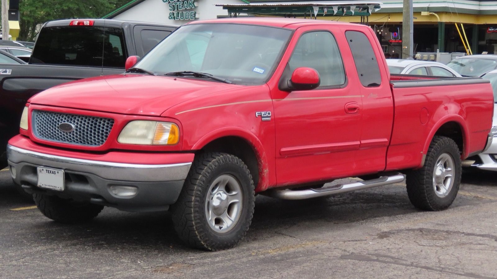1999 Ford F-150 lariat pickup truck, front three-quarter left view