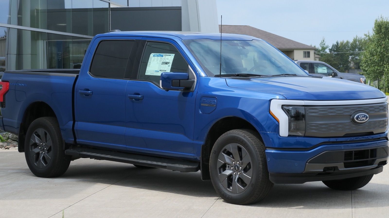 2022 Ford F-150 blue lightning pickup truck, front three-quarter right view