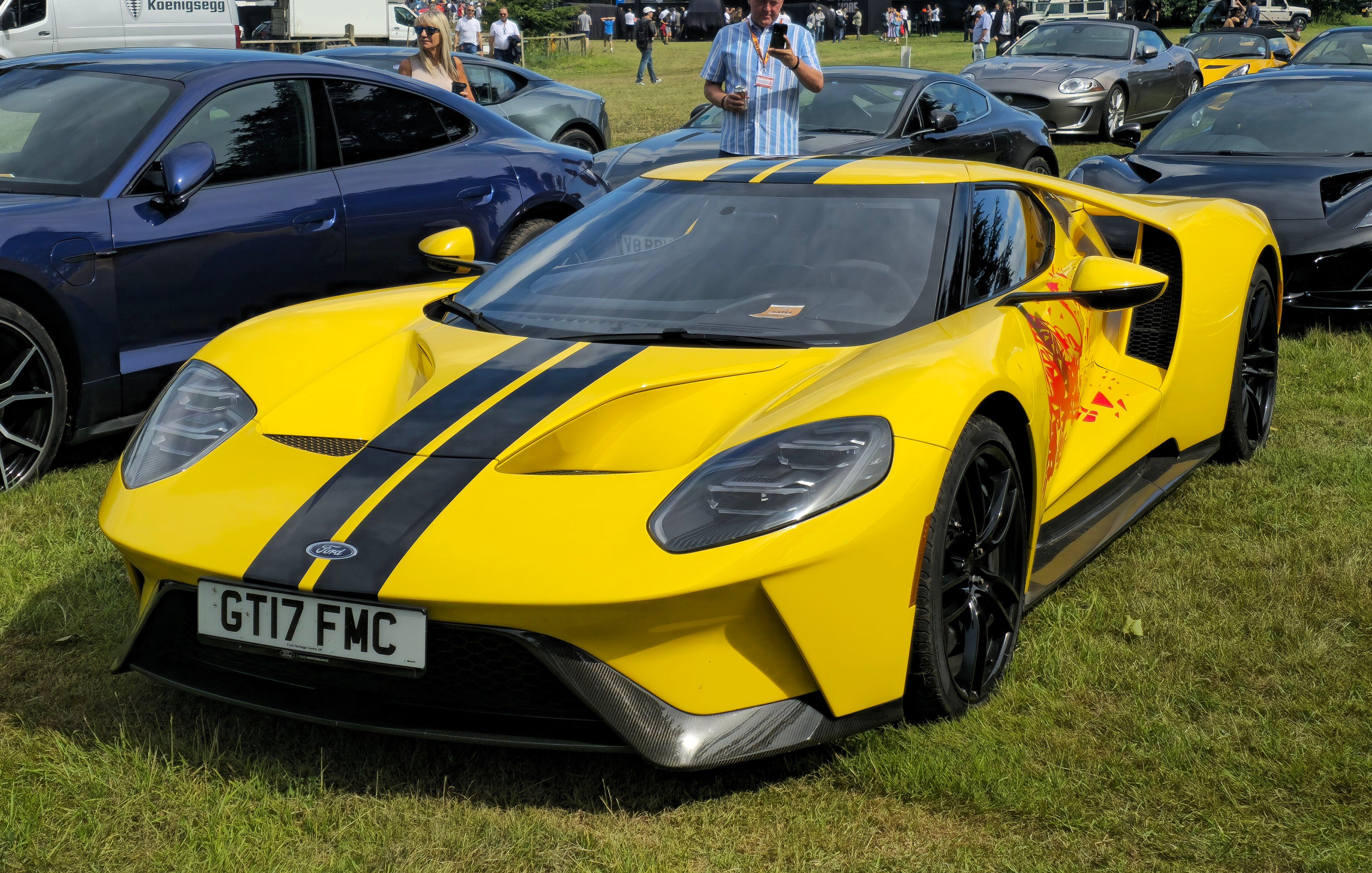 Yellow 2017 Ford GT with black stripes, front three-quarter view