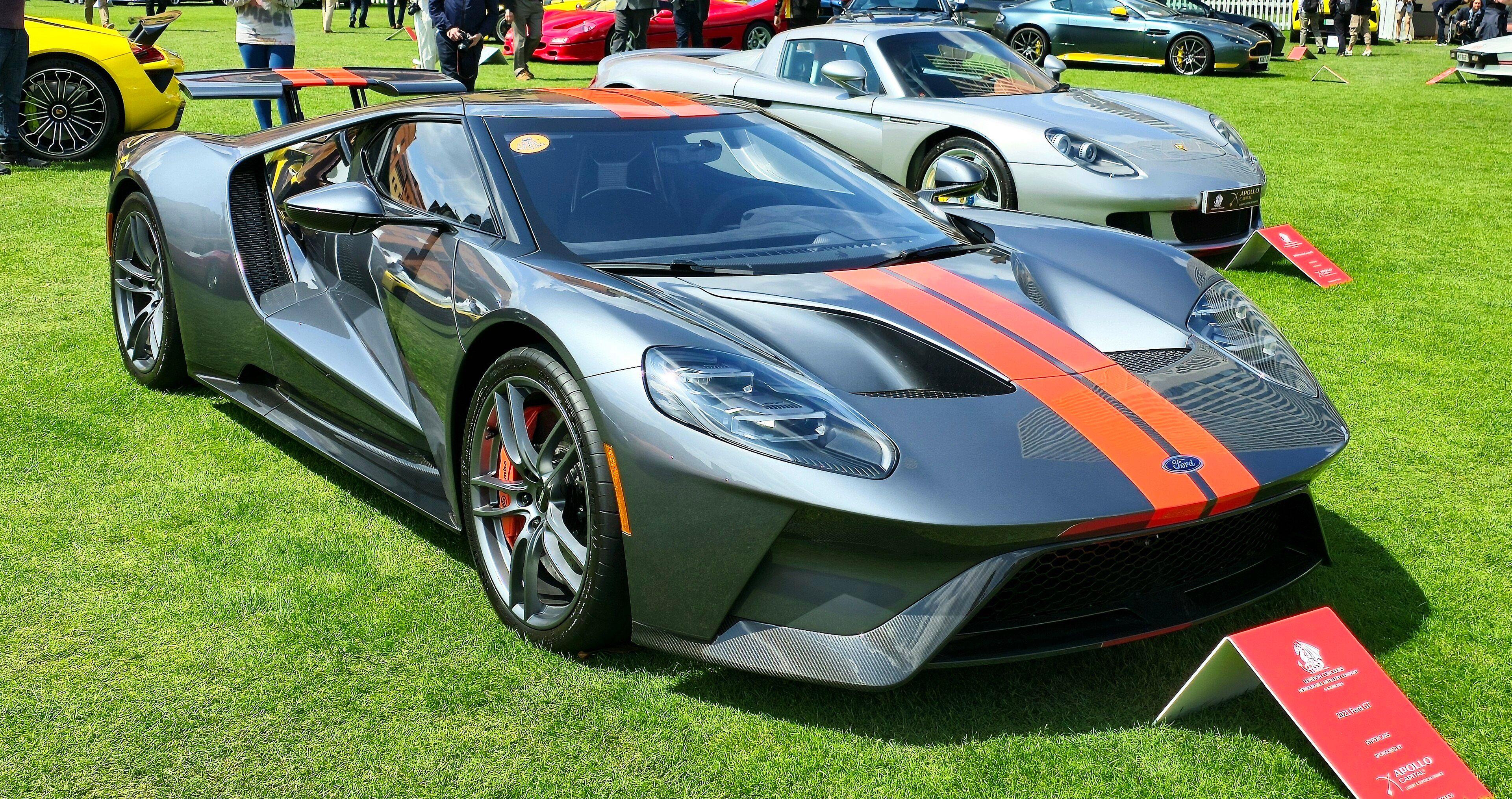 Grey 2021 Ford GT with orange stripes, front three-quarter view