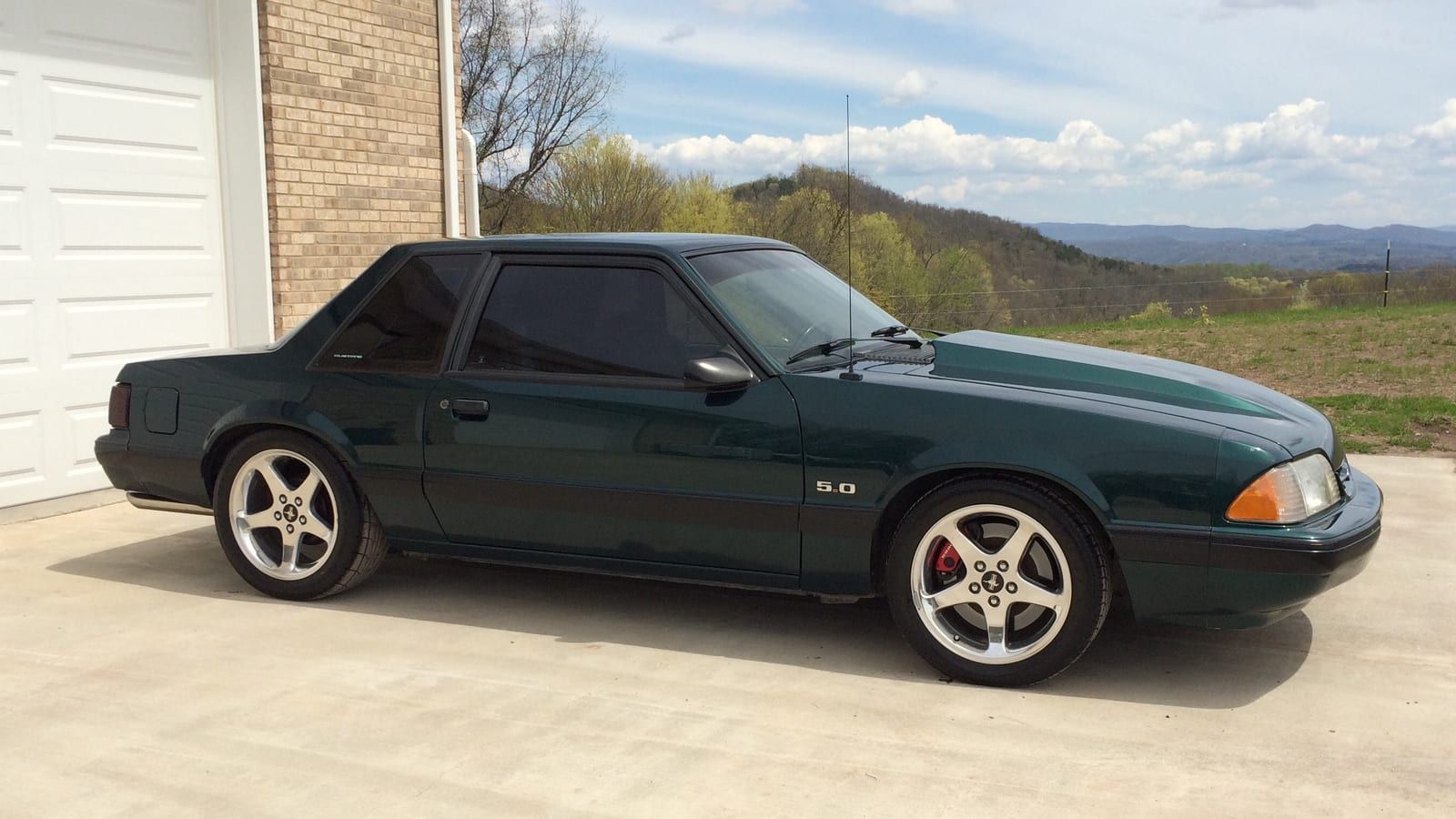 1991 Ford Mustang (Fox-body) — green LX 5.0 coupe, right side profile