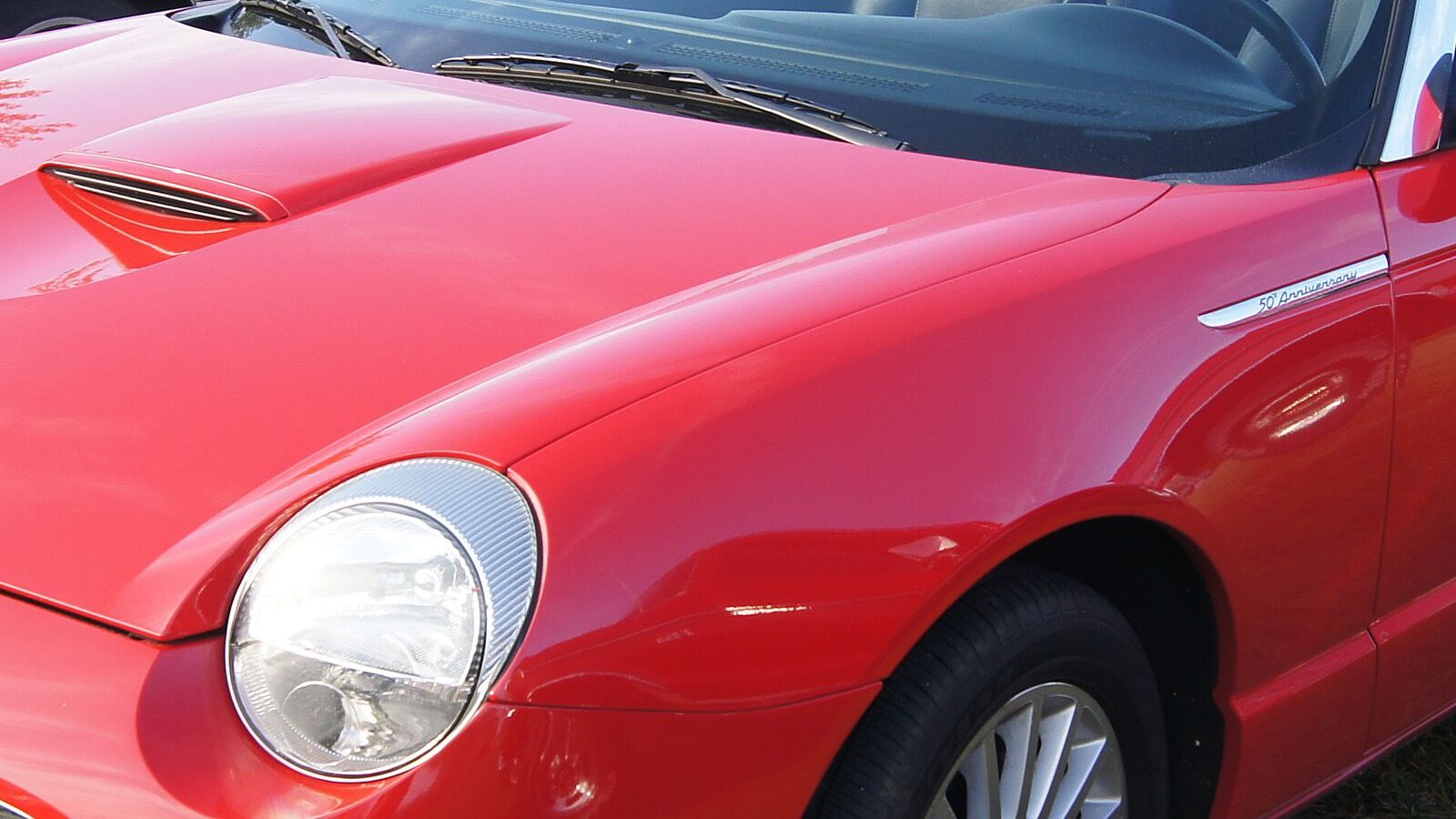2005 Ford Thunderbird, eleventh-generation retro roadster — convertible, front three-quarter view