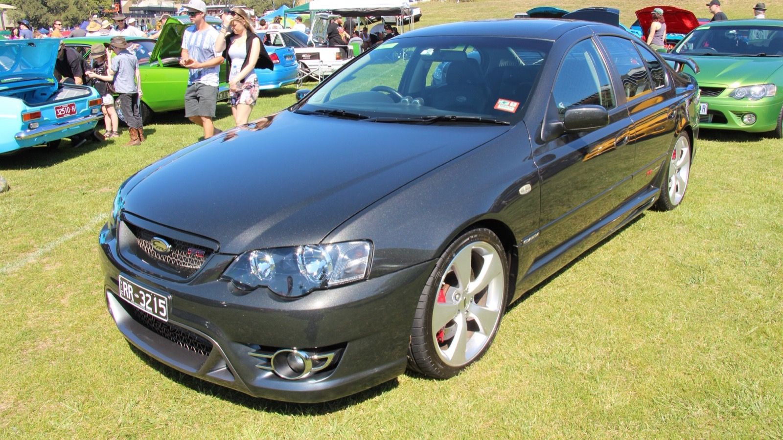 Dark grey 2007 FPV F6 (BF Falcon) sedan on grass, front three-quarter view