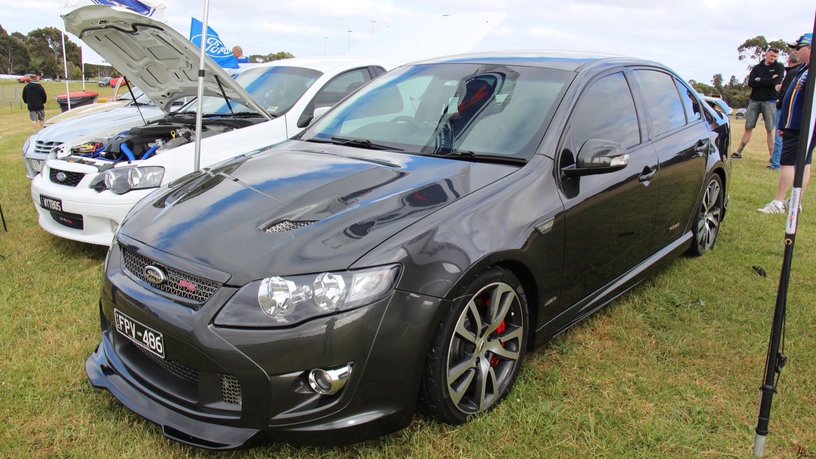 Dark grey 2009 FPV F6 (FG Falcon) sedan on grass, front three-quarter view
