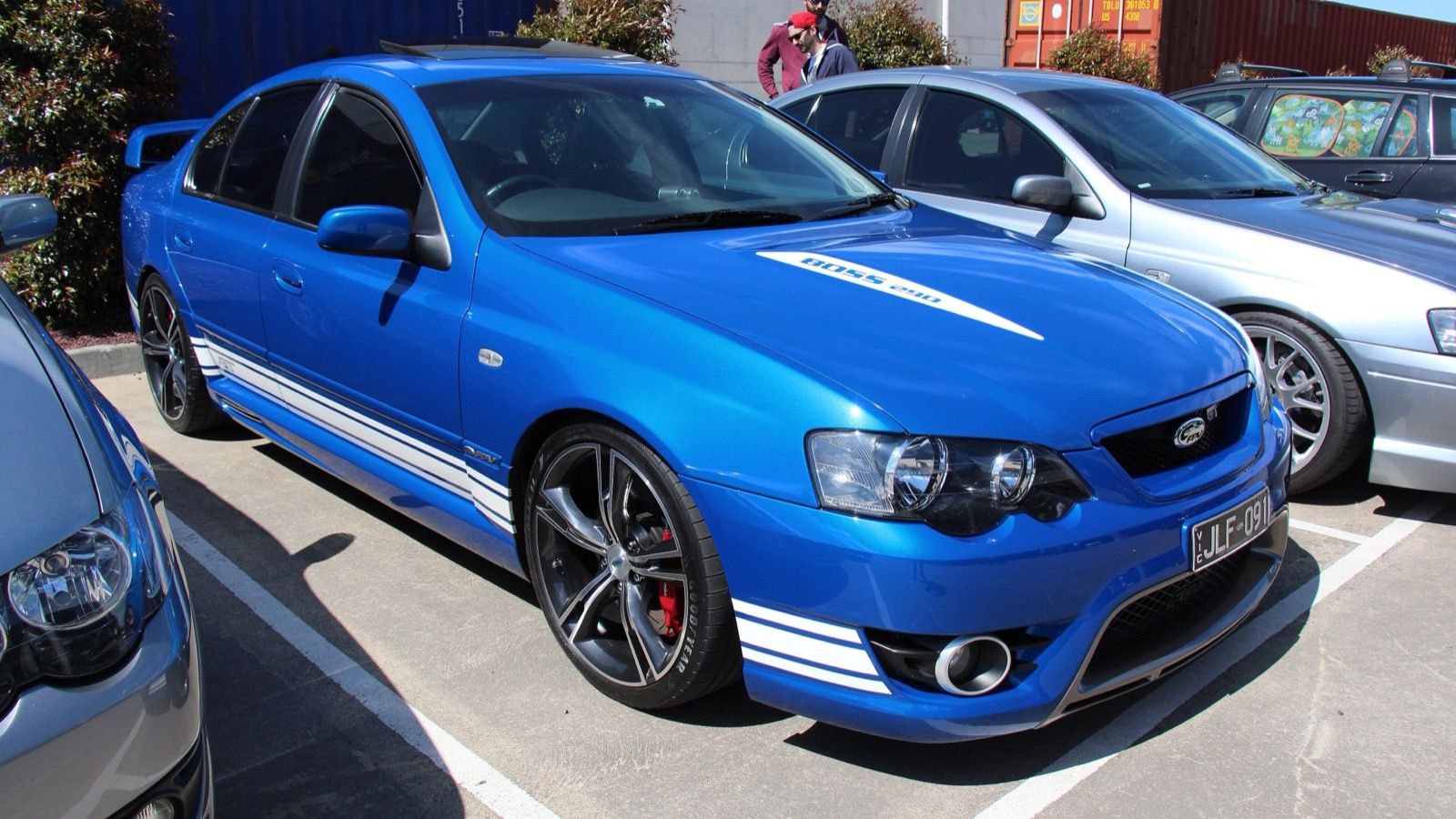 Blue 2006 FPV GT (BF Falcon) sedan with white stripes and Boss 290 bonnet badging, front three-quarter view