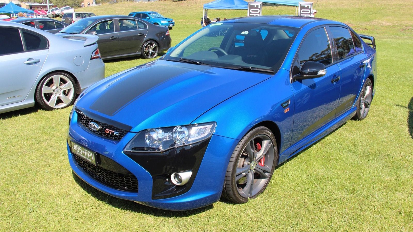 Blue 2014 FPV GT-F 351 (FG Falcon) sedan with black bonnet stripes, front three-quarter view