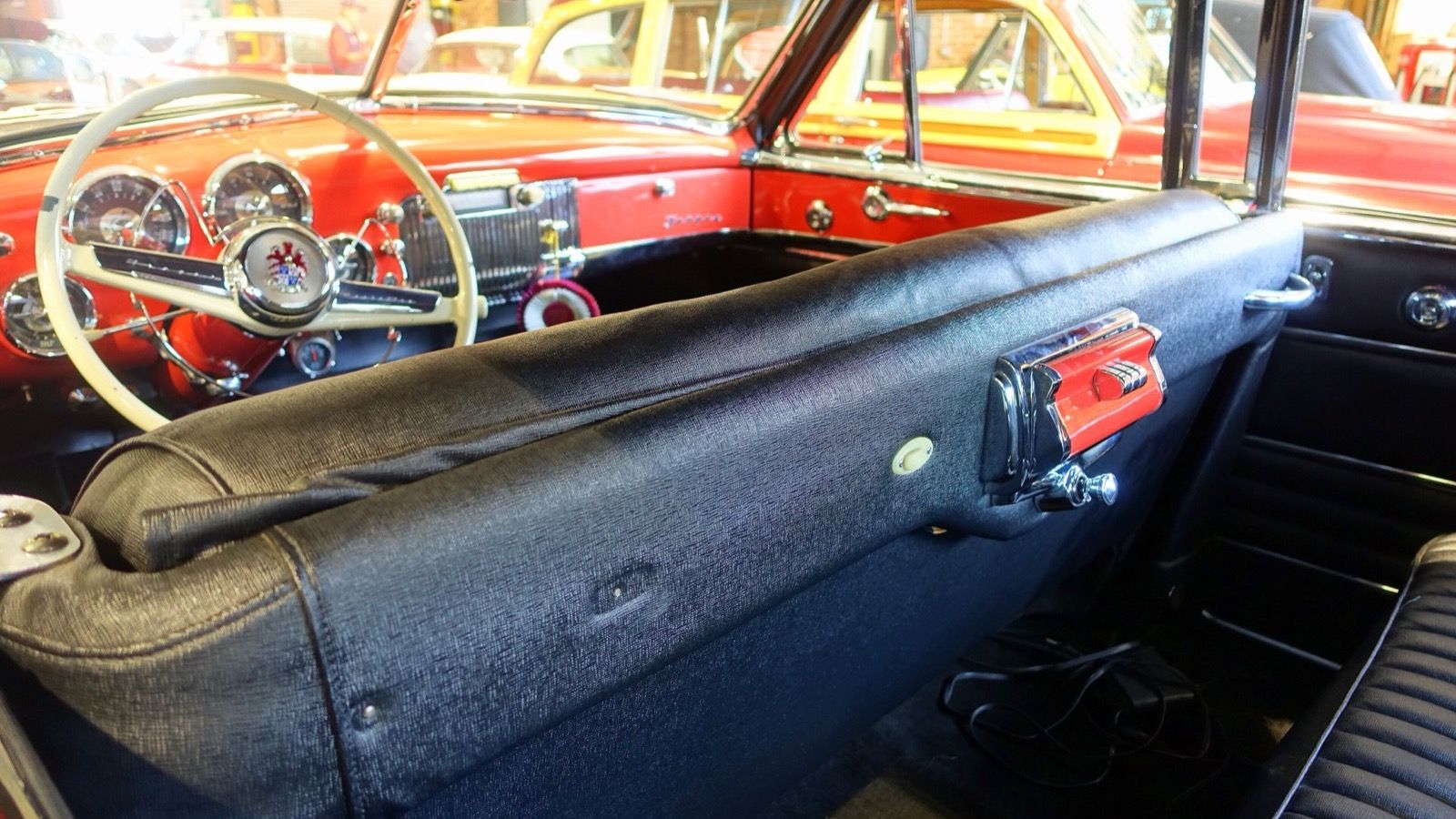 Interior of a 1949 Frazer Manhattan, showing the front seat and dashboard