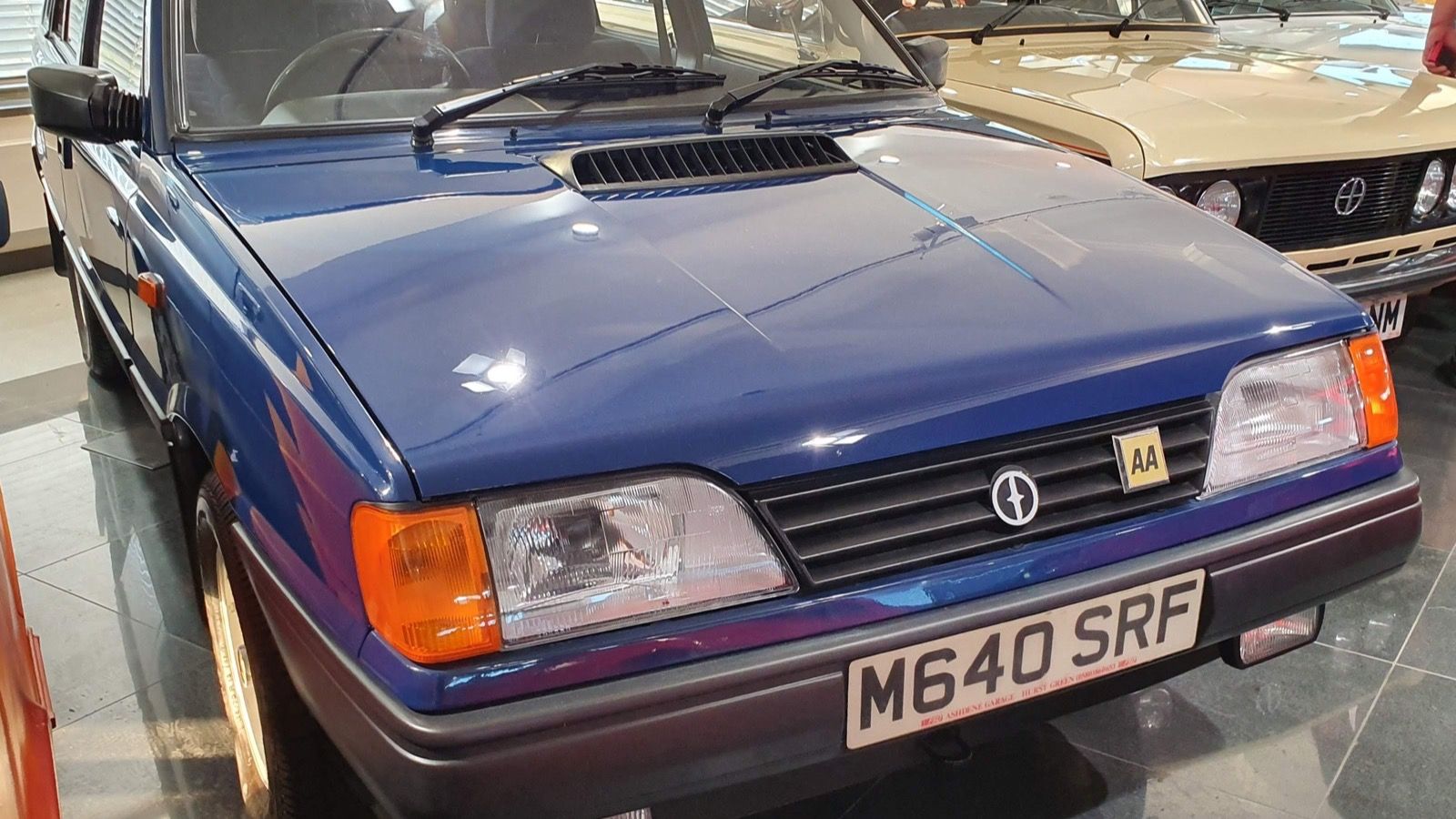 Blue FSO Polonez Caro MR'93 five-door hatchback on museum display, front three-quarter view