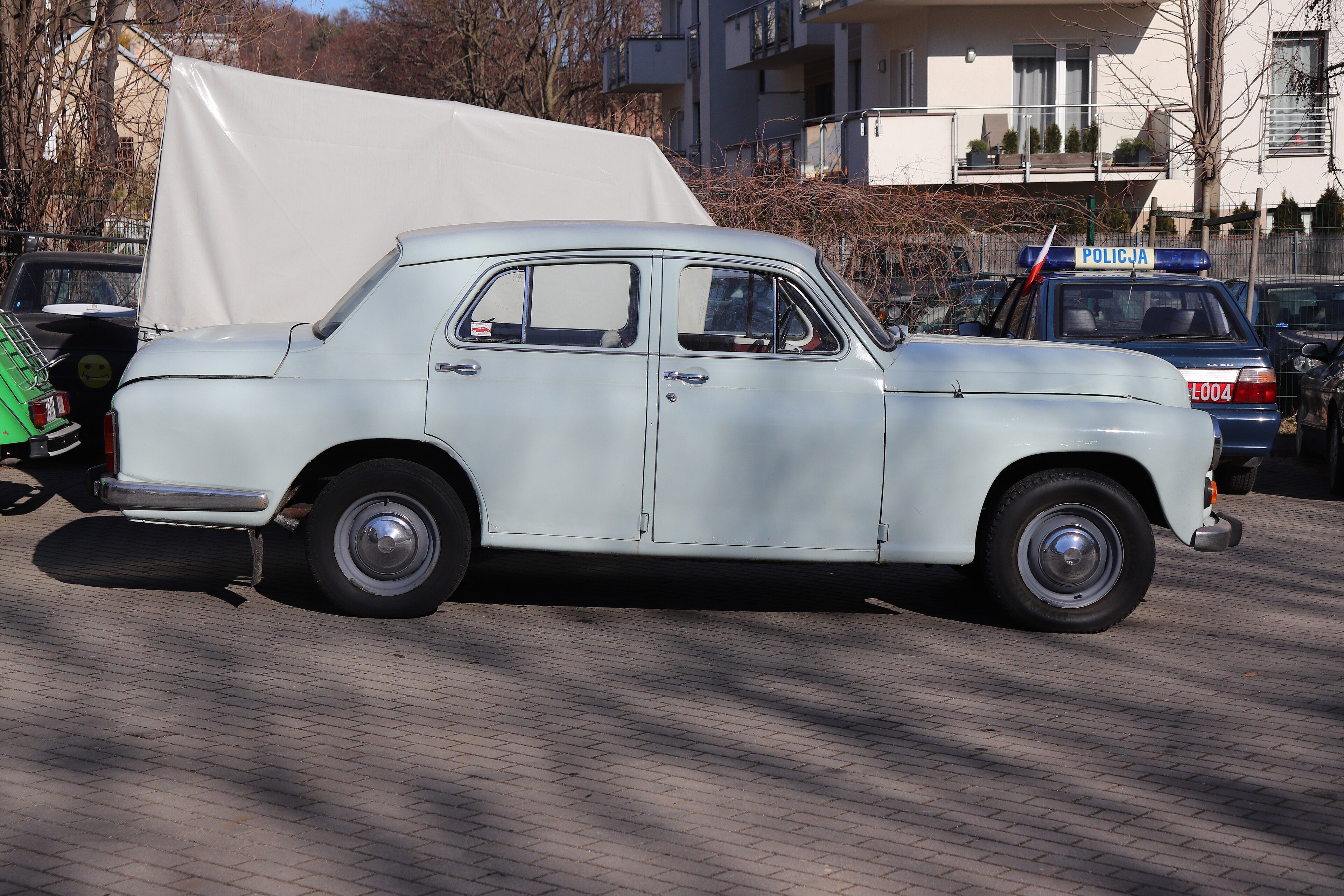 Pale blue FSO Warszawa 223 three-box saloon parked in Gdańsk, side profile view