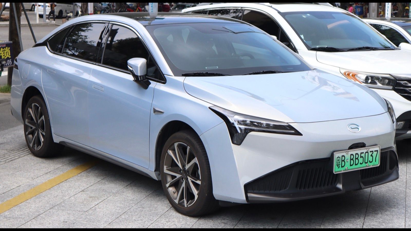 Pale blue GAC Aion S Plus, front three-quarter view