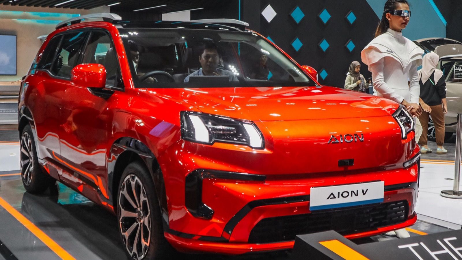 Red 2025 GAC Aion V on display at IIMS in Indonesia, front three-quarter view