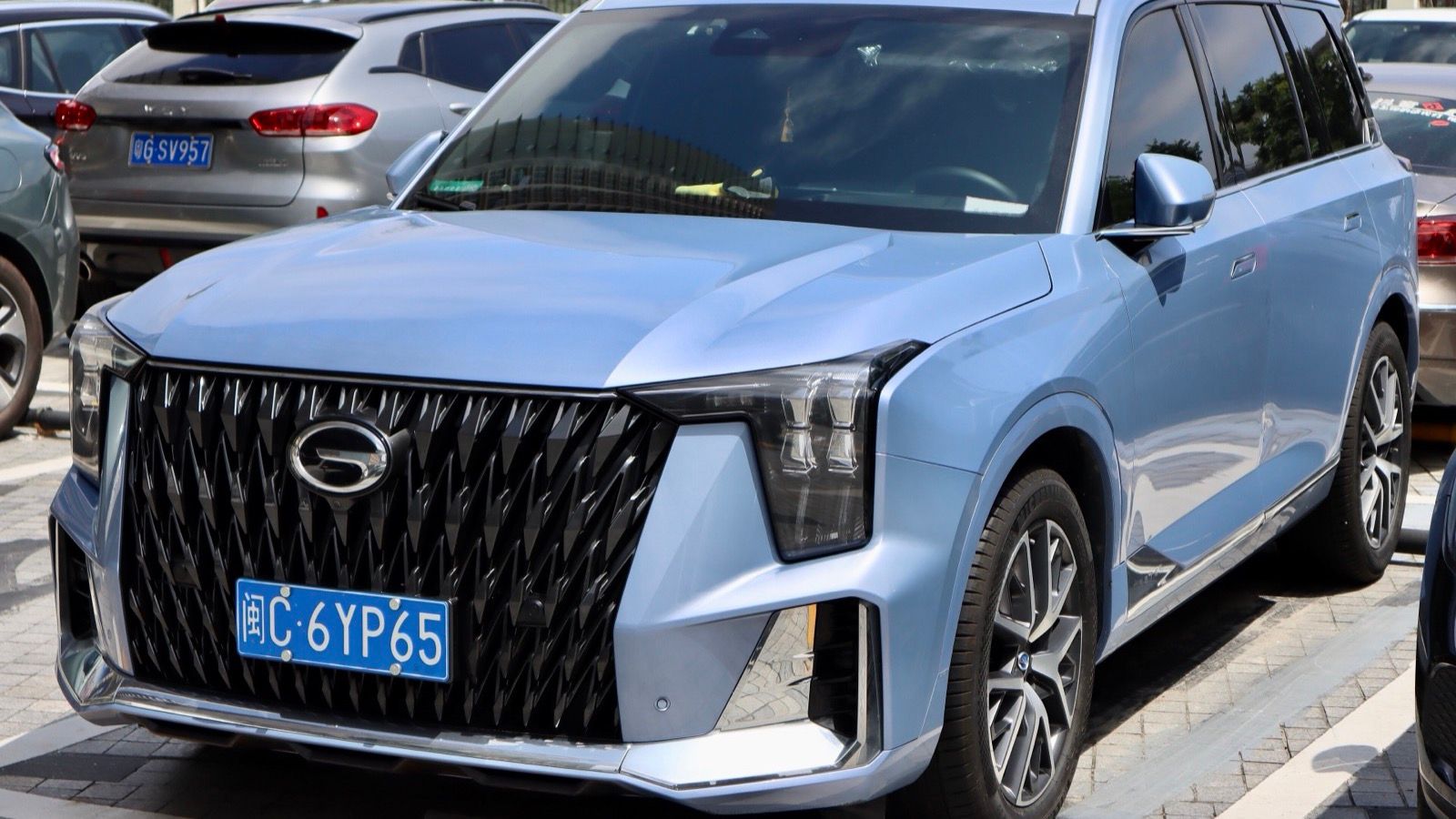 Light blue 2022 GAC Trumpchi GS8, front three-quarter view