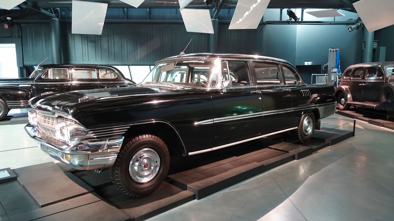 Black GAZ-13 Chaika limousine on display at the Riga Motor Museum, front three-quarter view