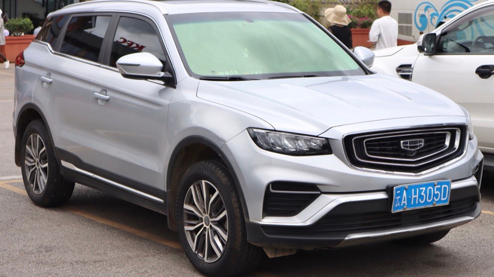 Silver 2019 Geely Boyue Pro compact SUV parked in a car park, front three-quarter view