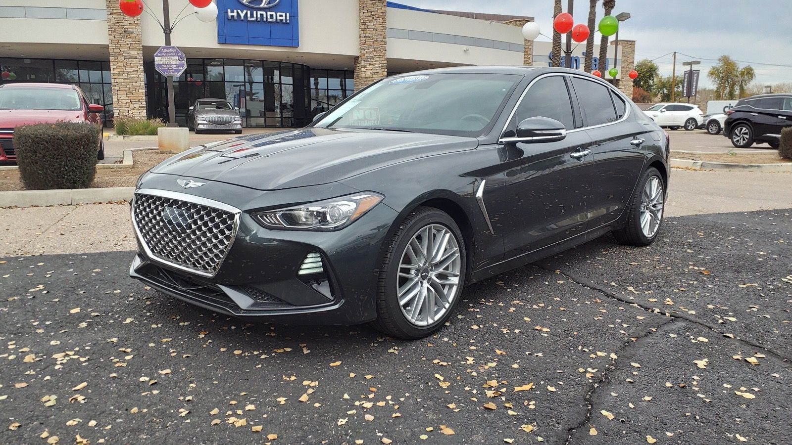 Dark grey 2020 Genesis G70 2.0T, front three-quarter view