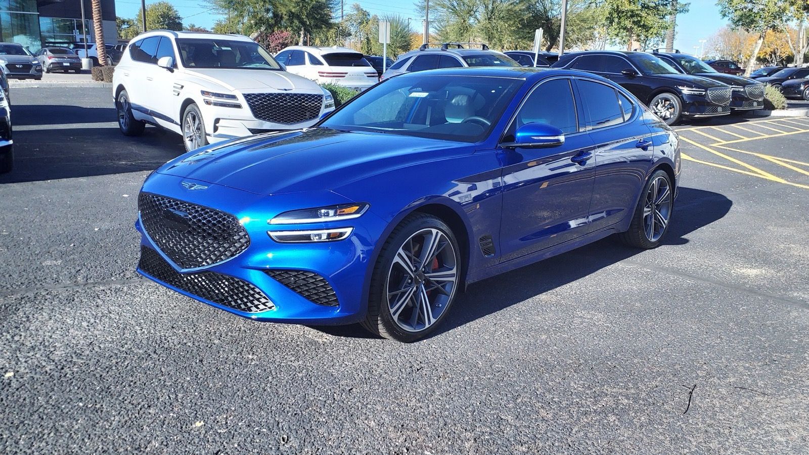 Blue refreshed Genesis G70 3.3T Sport Advanced, front three-quarter view