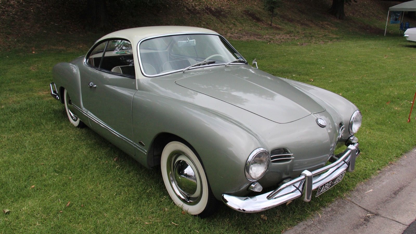 Grey 1958 Volkswagen Karmann Ghia Type 14 coupé, front three-quarter view.