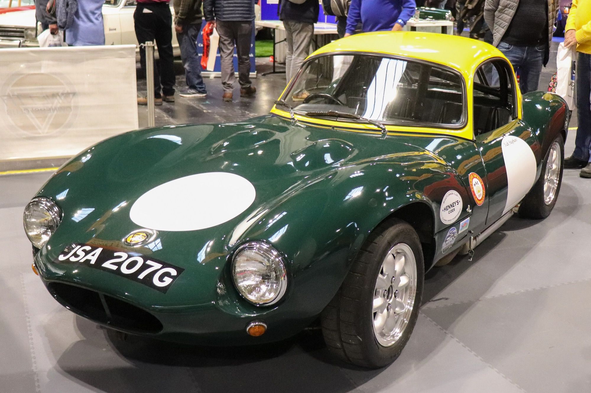 Green 1968 Ginetta G4 1.6 coupé with yellow roof, front three-quarter view