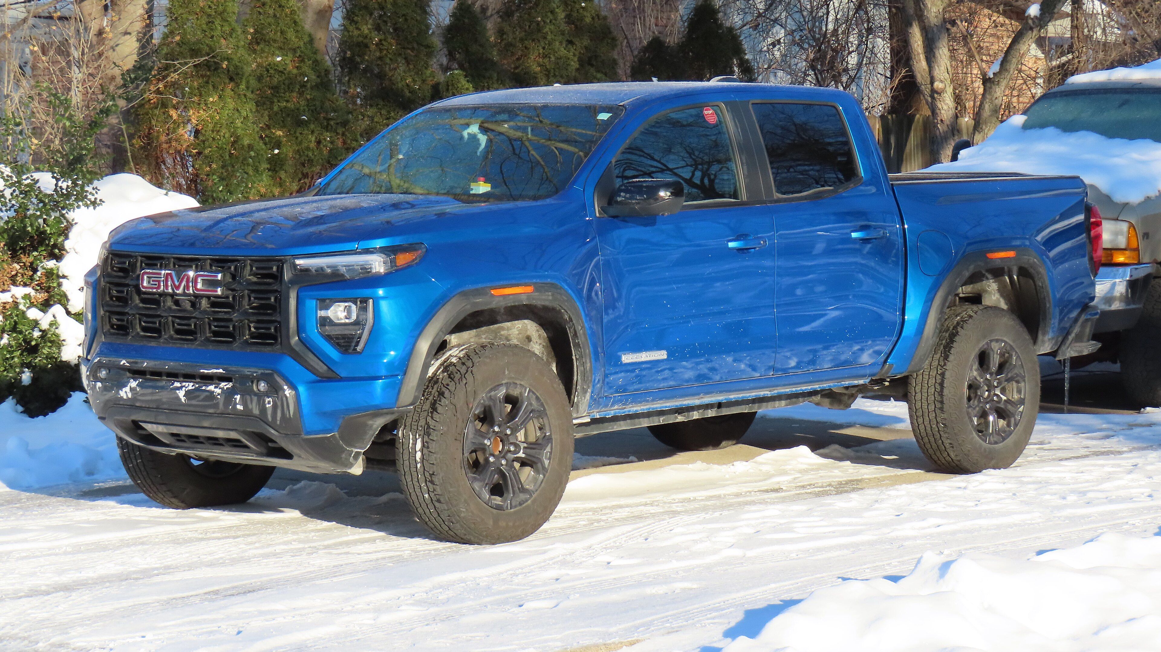 Third-generation 2023 GMC Canyon mid-size pickup, front three-quarter view
