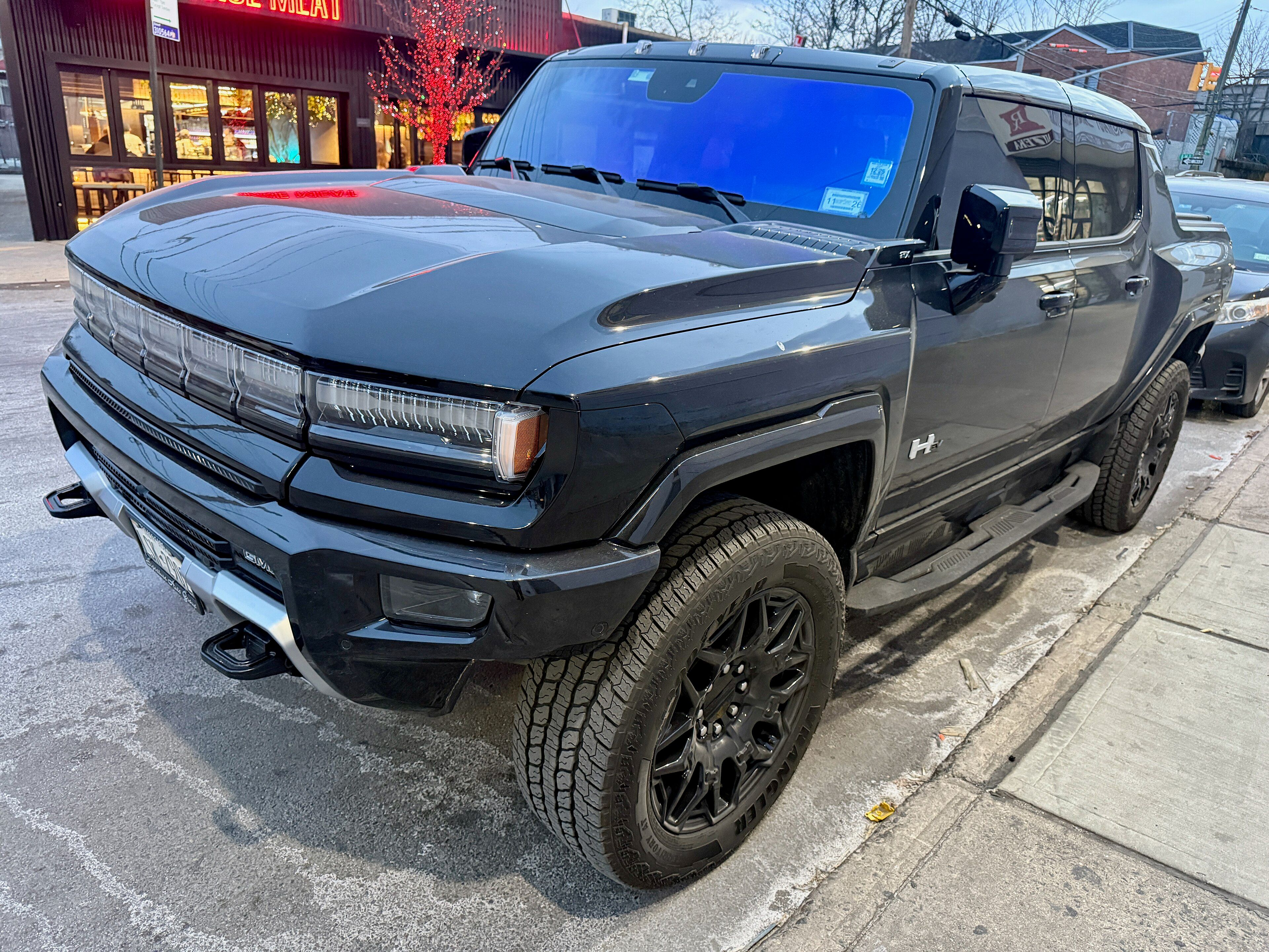 GMC Hummer EV electric pickup truck, front three-quarter view