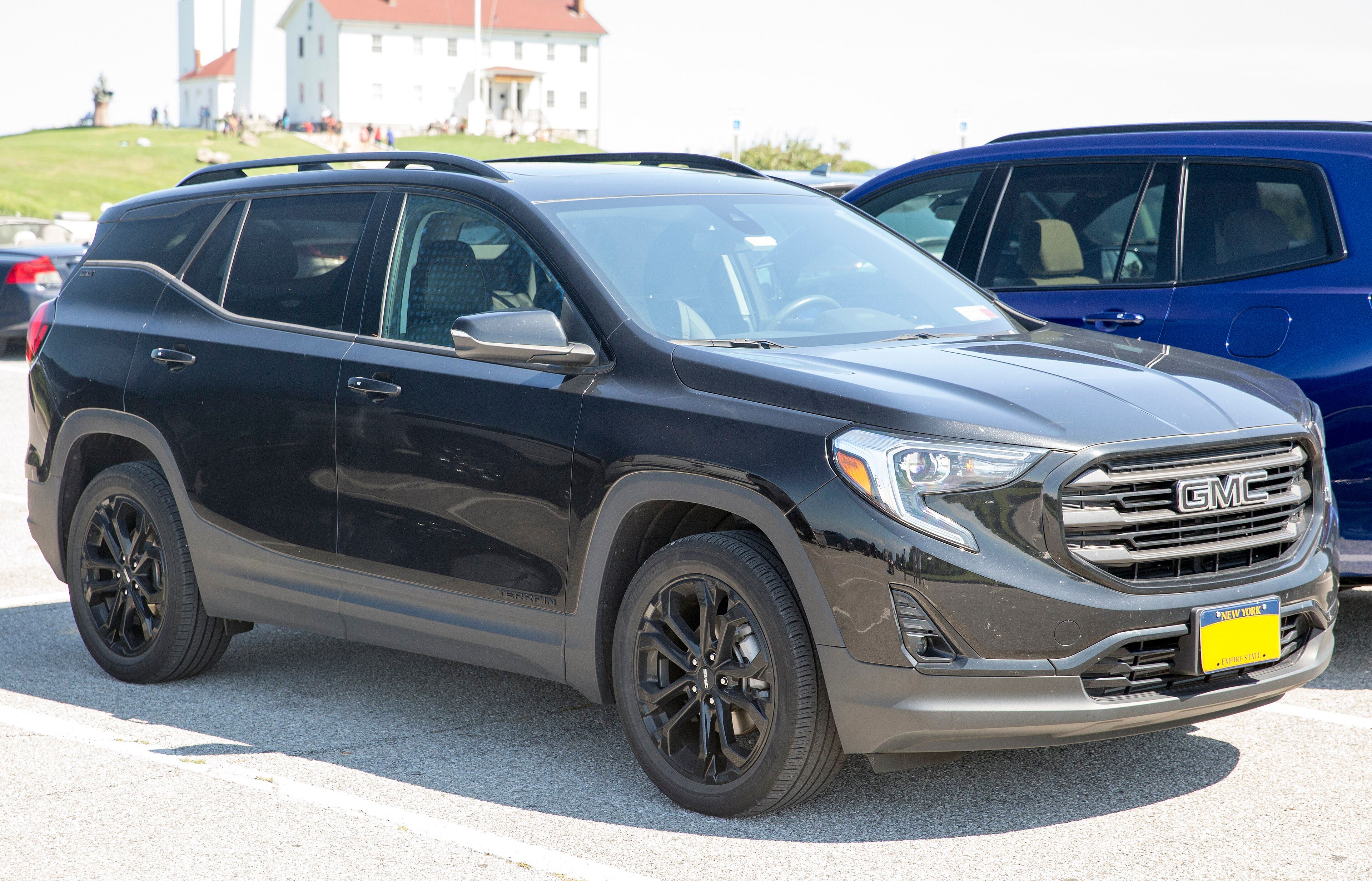 2021 GMC Terrain SLT AWD compact crossover in Ebony Twilight Metallic, front right view