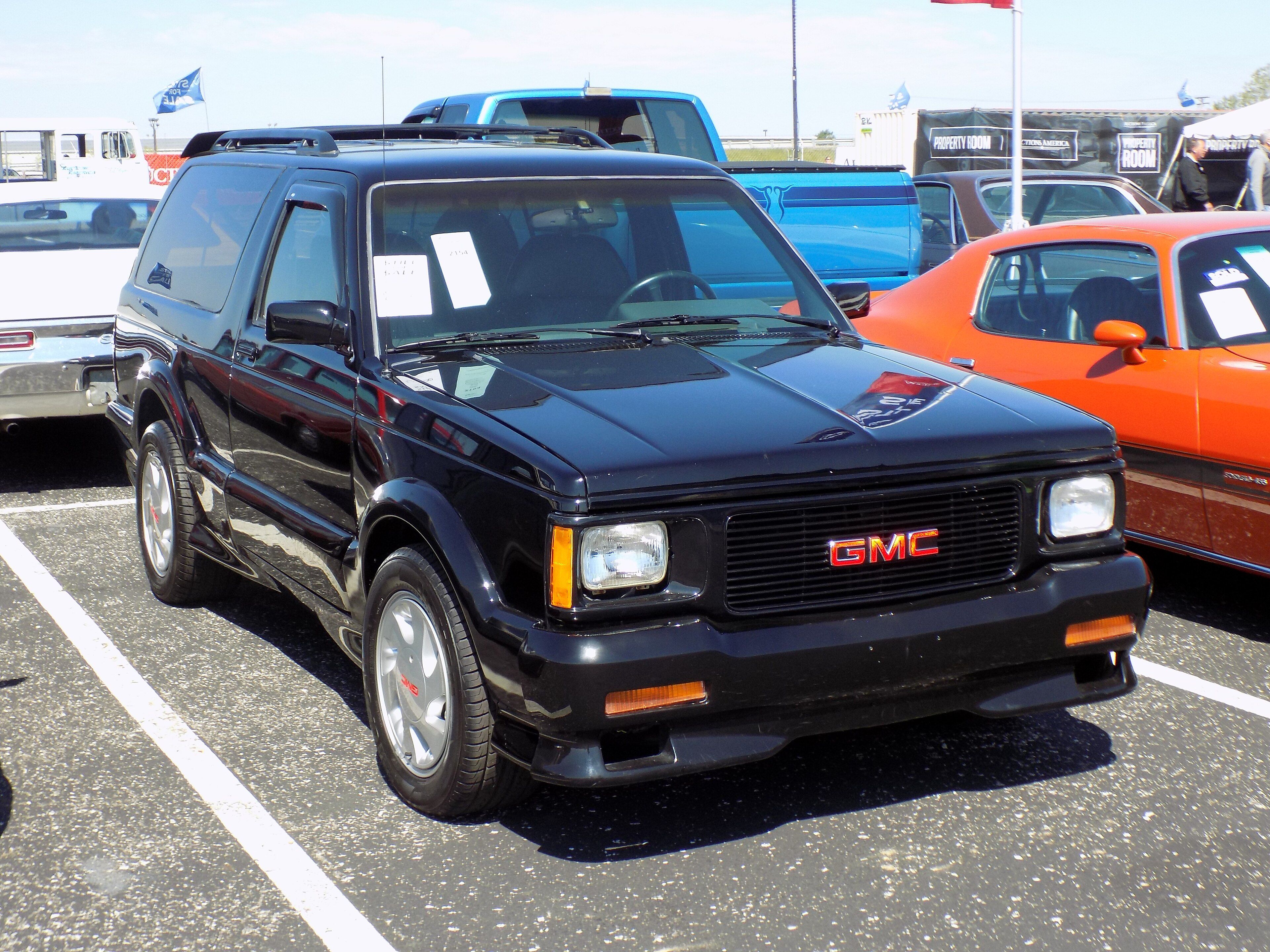 Red 1993 GMC Typhoon performance SUV, front three-quarter view