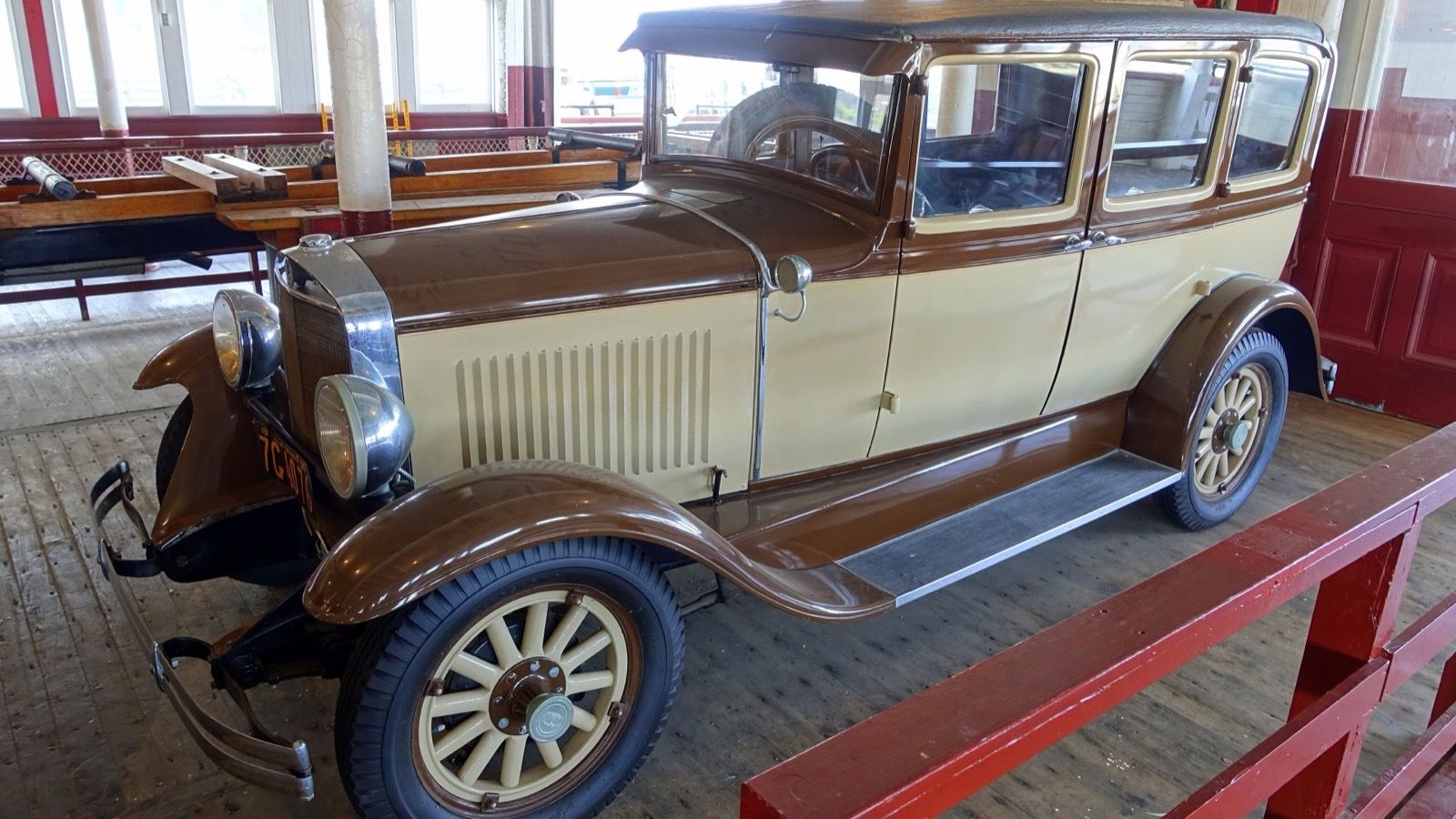 Brown and cream 1930 Graham-Paige sedan on museum display, front three-quarter view