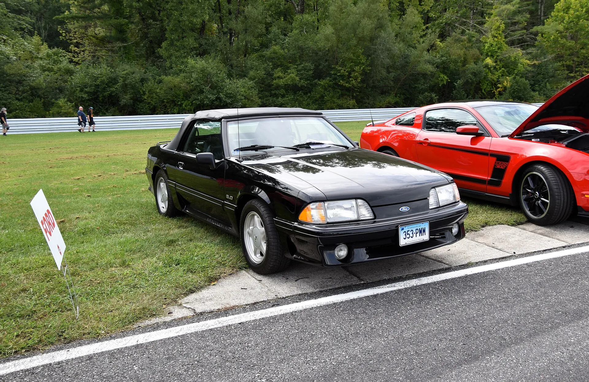 Red 1993 Ford Mustang GT convertible photographed from the front left