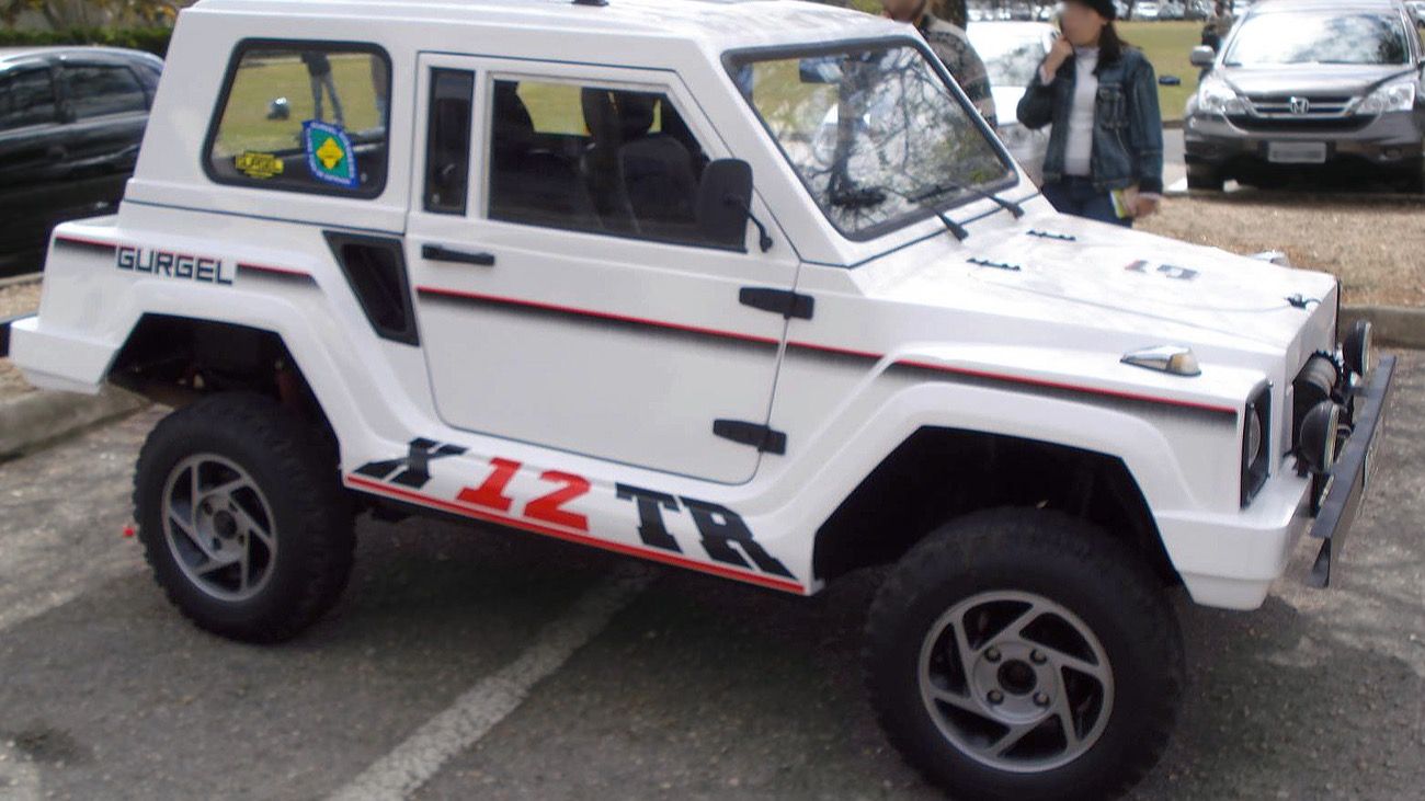 Gurgel Xavante X-12 TR in white, side three-quarter view, showing the round-headlight pre-Tocantins front end.