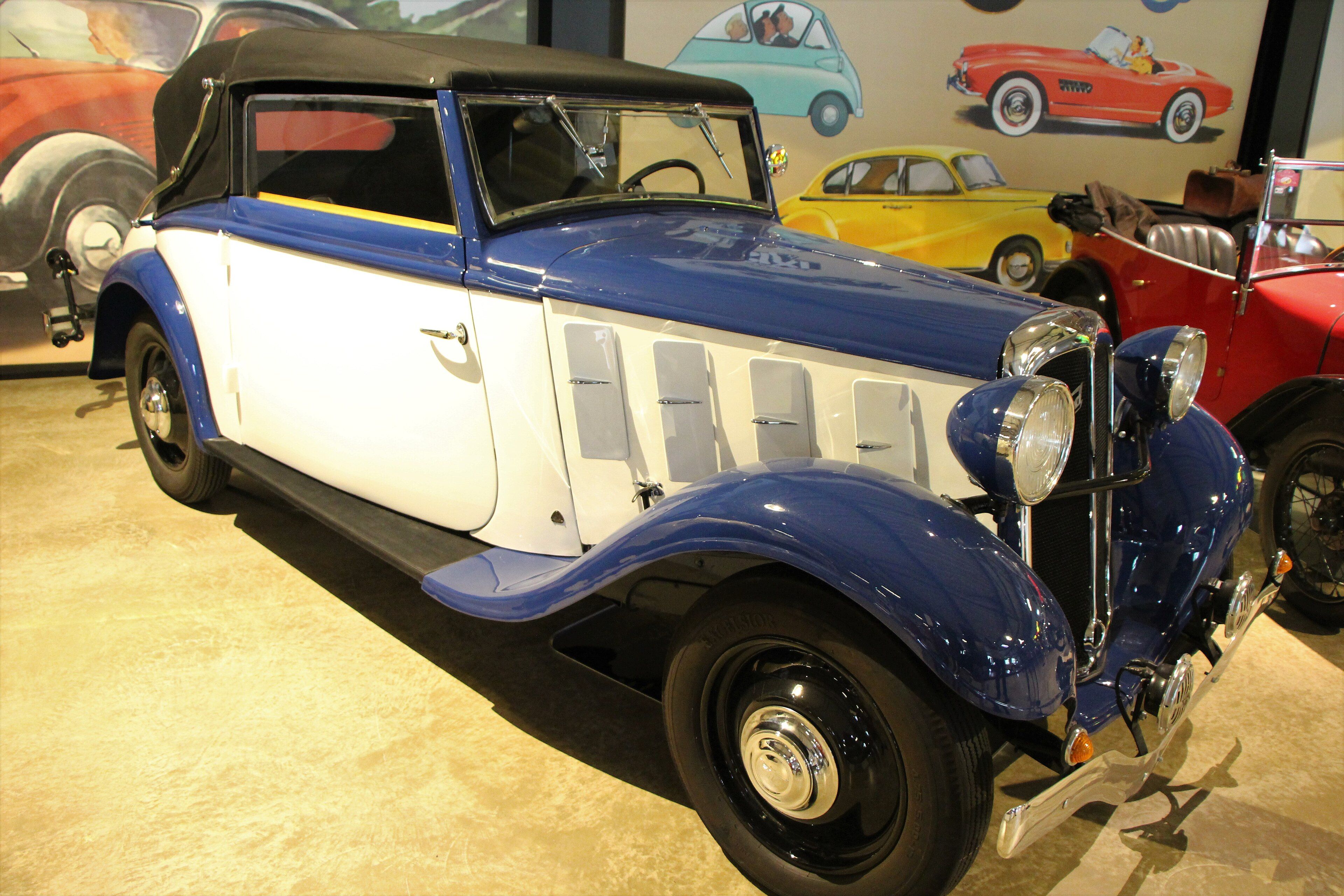 Blue and white first-series Hanomag Rekord drophead coupé with the roof raised, front three-quarter view