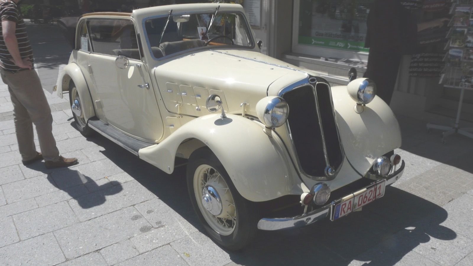 Cream 1937 Hansa 1100 cabriolet parked on a paved street, front three-quarter view
