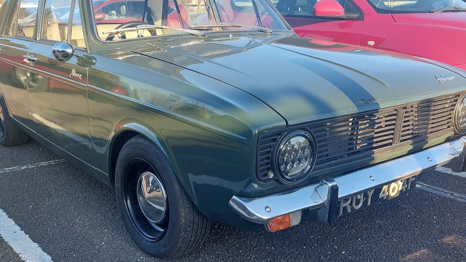 Dark green 1967 Hillman Minx 1500 Arrow saloon in a car park, front three-quarter view