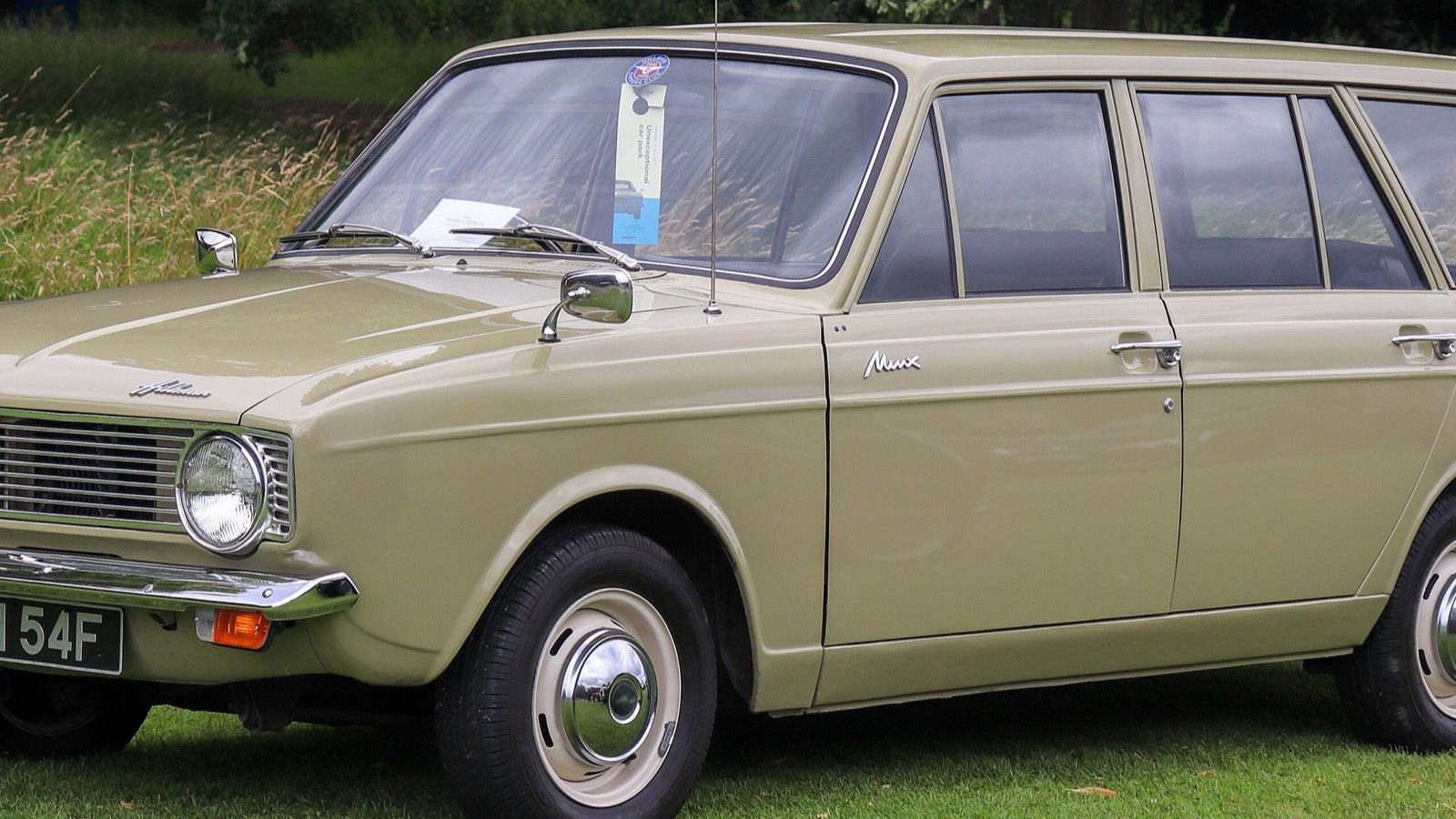 Beige 1968 Hillman Minx 1.5 estate parked on grass, front three-quarter view