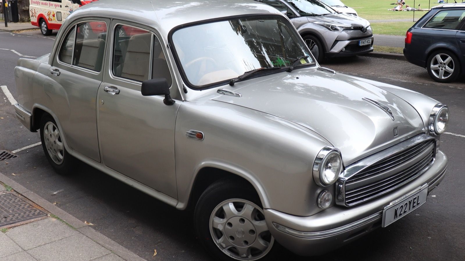 Silver 2005 Hindustan Ambassador Grand BS-3 1800 ISZ parked at a kerbside, front three-quarter view