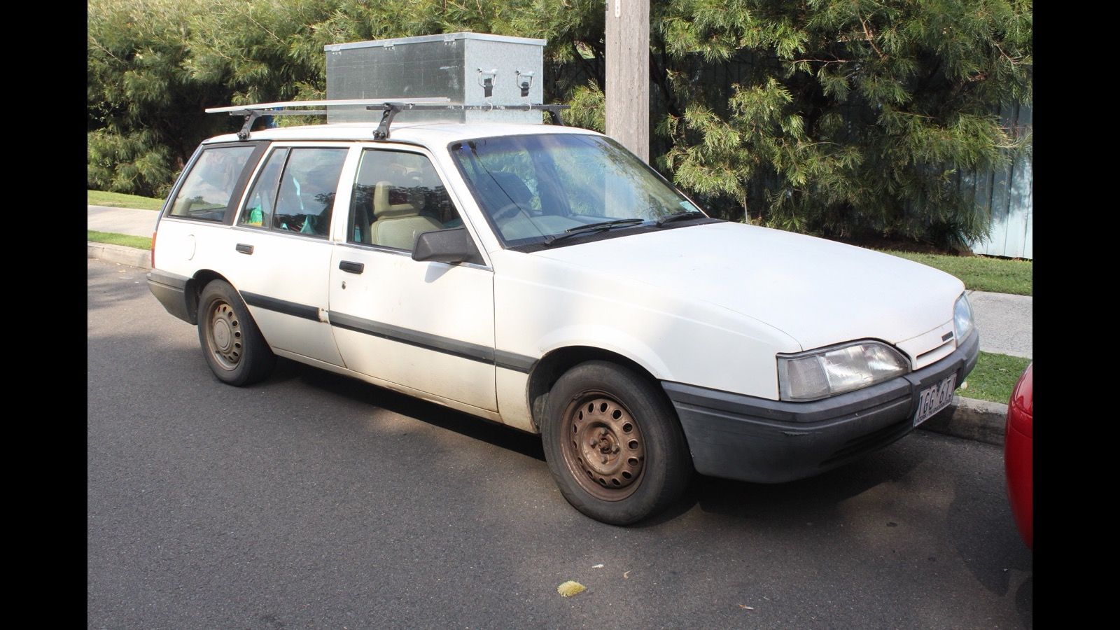 White 1988 Holden Camira JE SL station wagon parked at a kerb, front three-quarter view