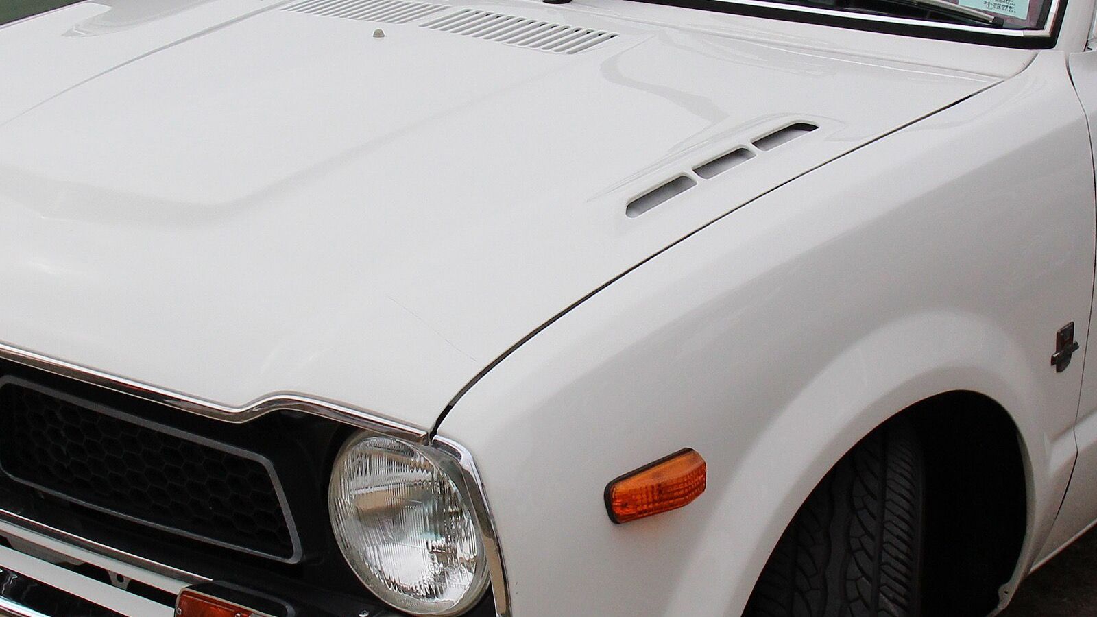 1973 Honda Civic, SB/SG first generation — yellow coupe, front three-quarter view