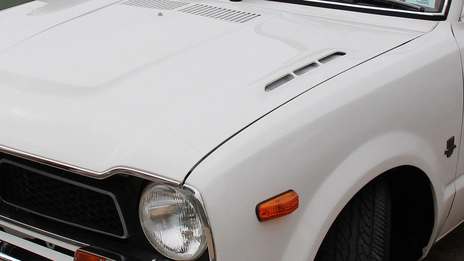 1973 Honda Civic, SB/SG first generation — yellow coupe, front three-quarter view