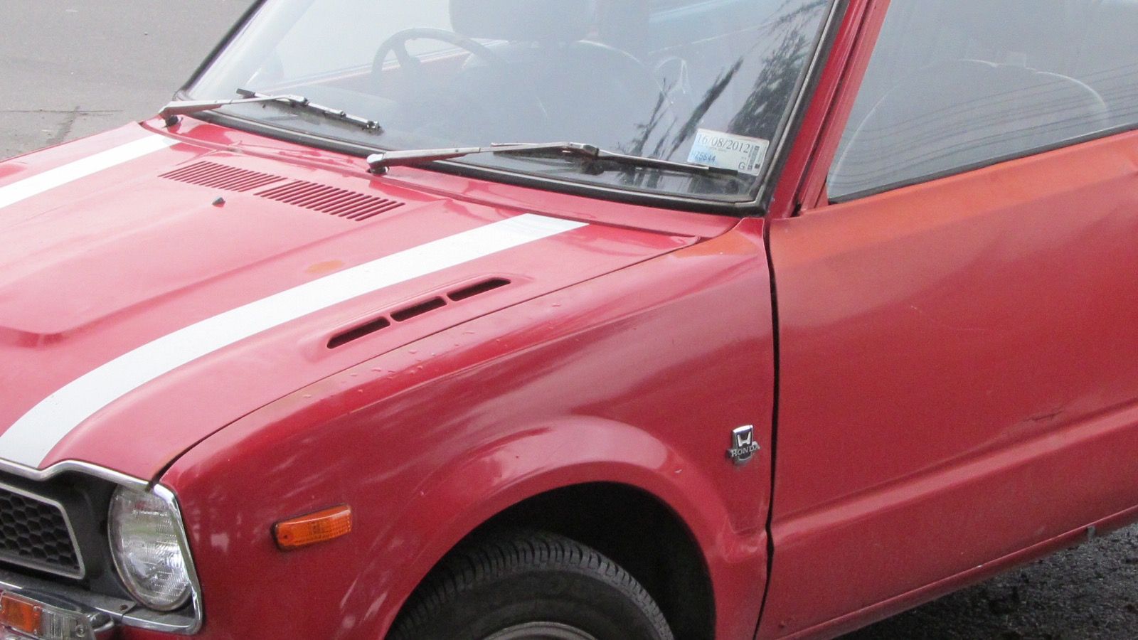 1975 Honda Civic — blue hatchback, front three-quarter view