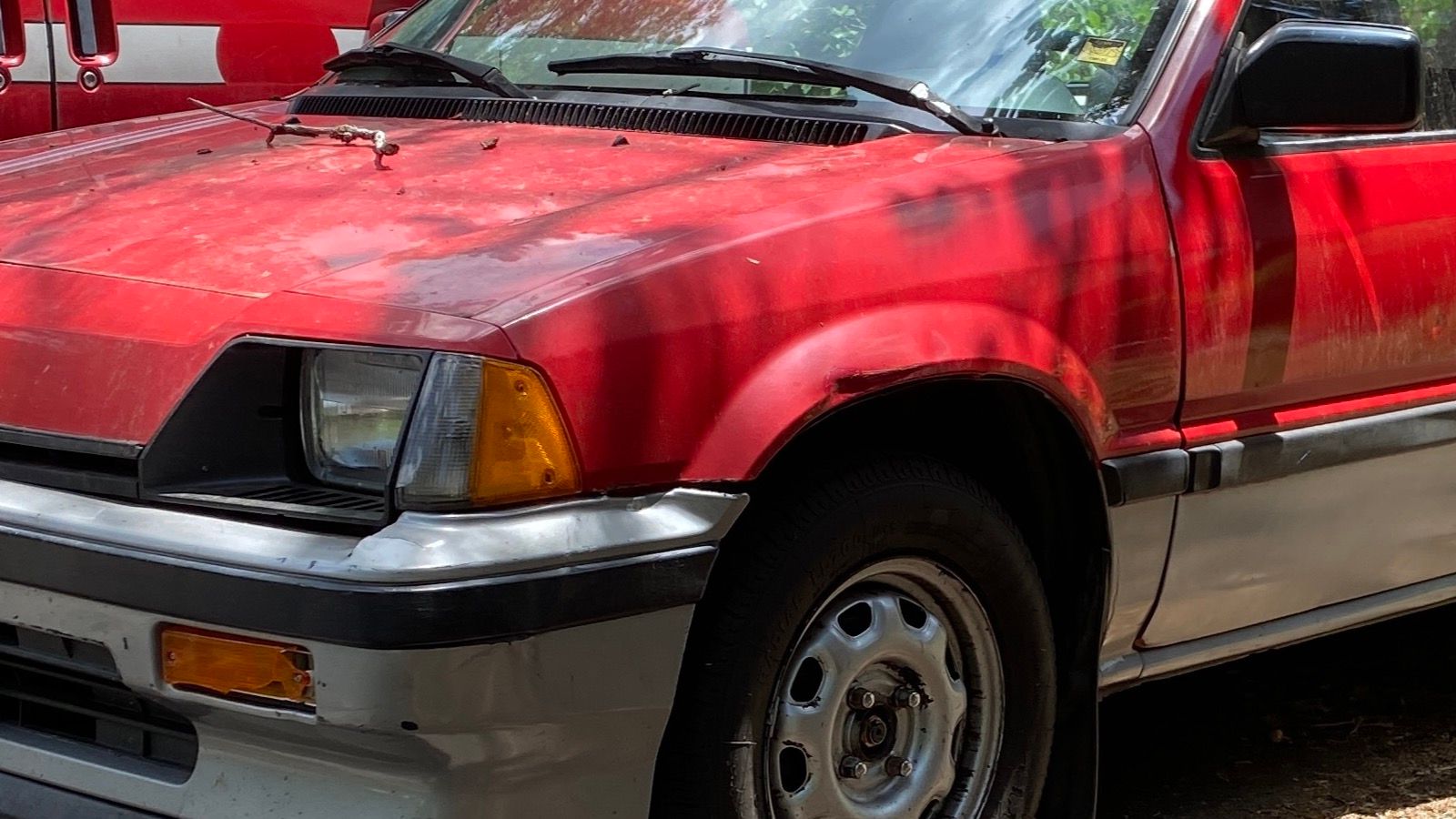 1985 Honda Civic — red hatchback, front three-quarter view