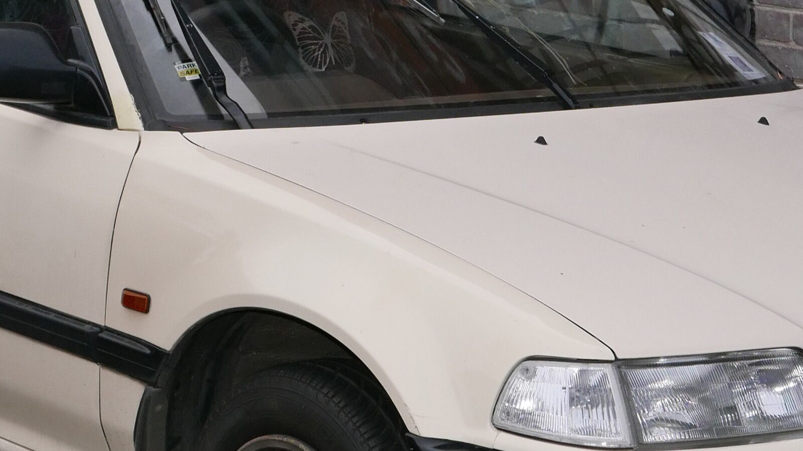1987 Honda Civic — white hatchback, front three-quarter view