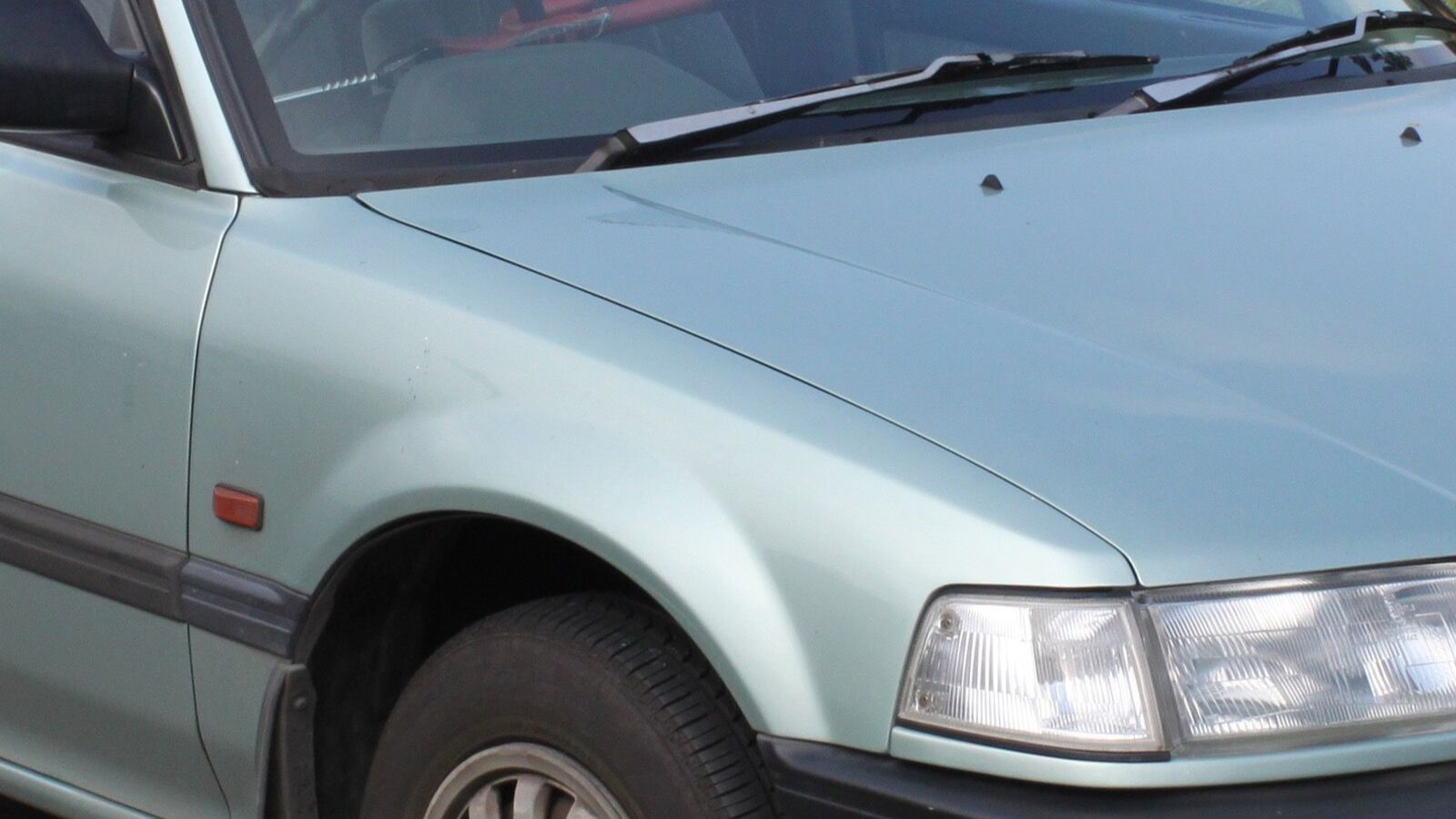 1989 Honda Civic — white sedan, front three-quarter view
