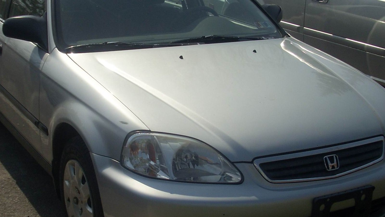 1999 Honda Civic — white sedan, front three-quarter view