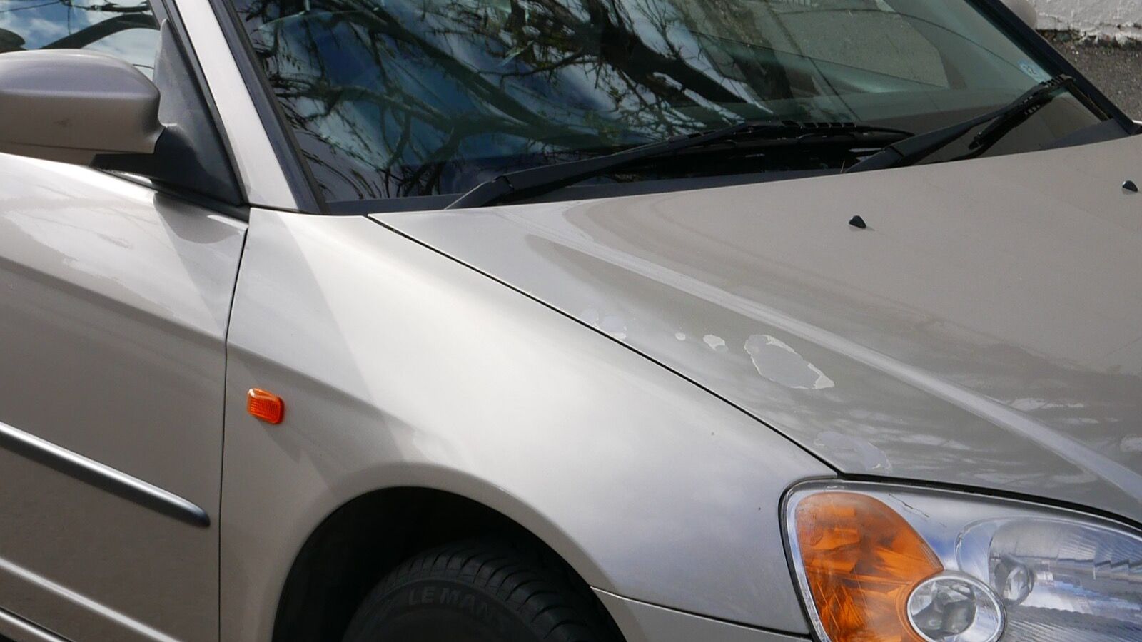 2000 Honda Civic — silver sedan, front three-quarter view