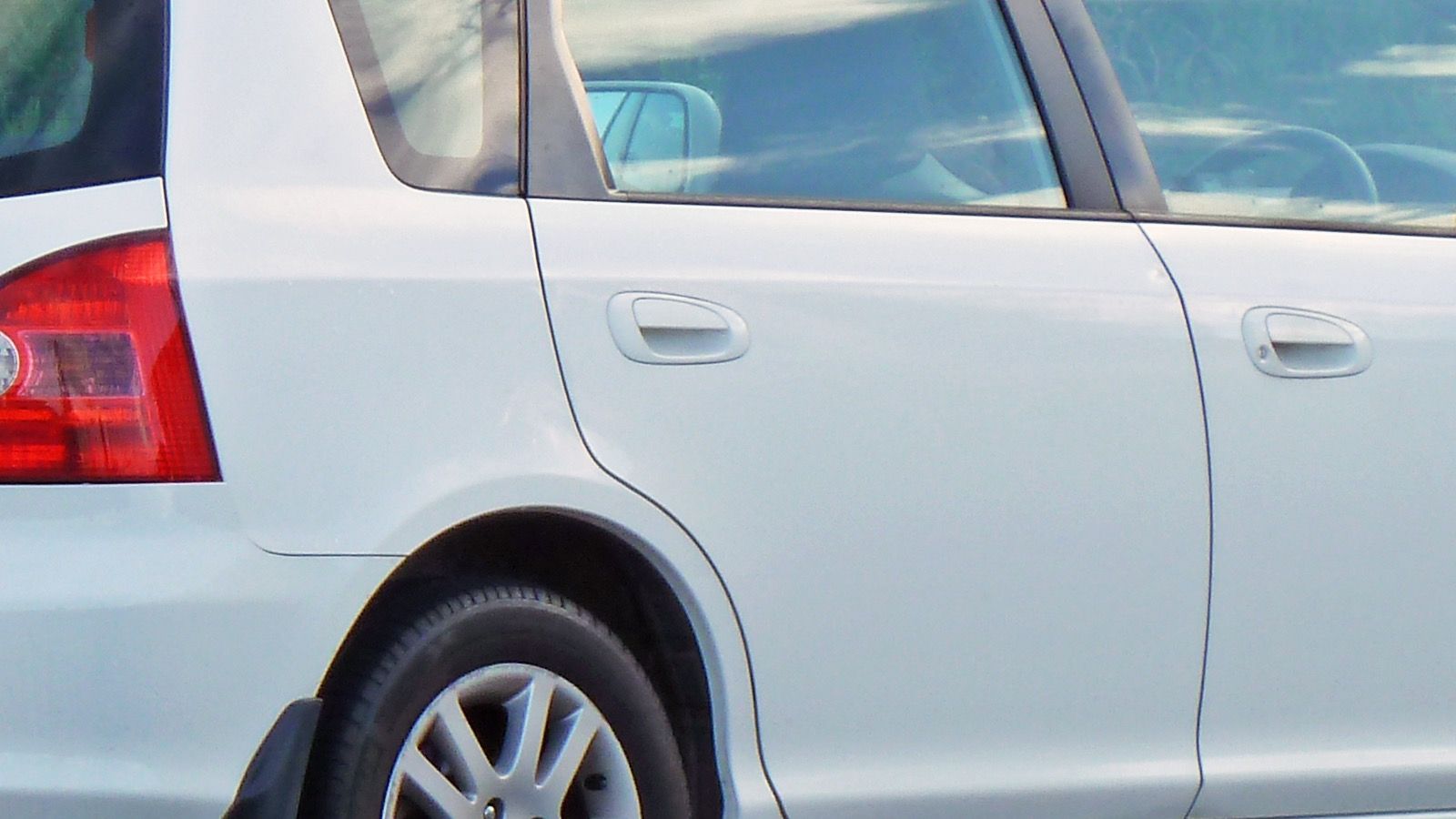 2003 Honda Civic — gray hatchback, front three-quarter view