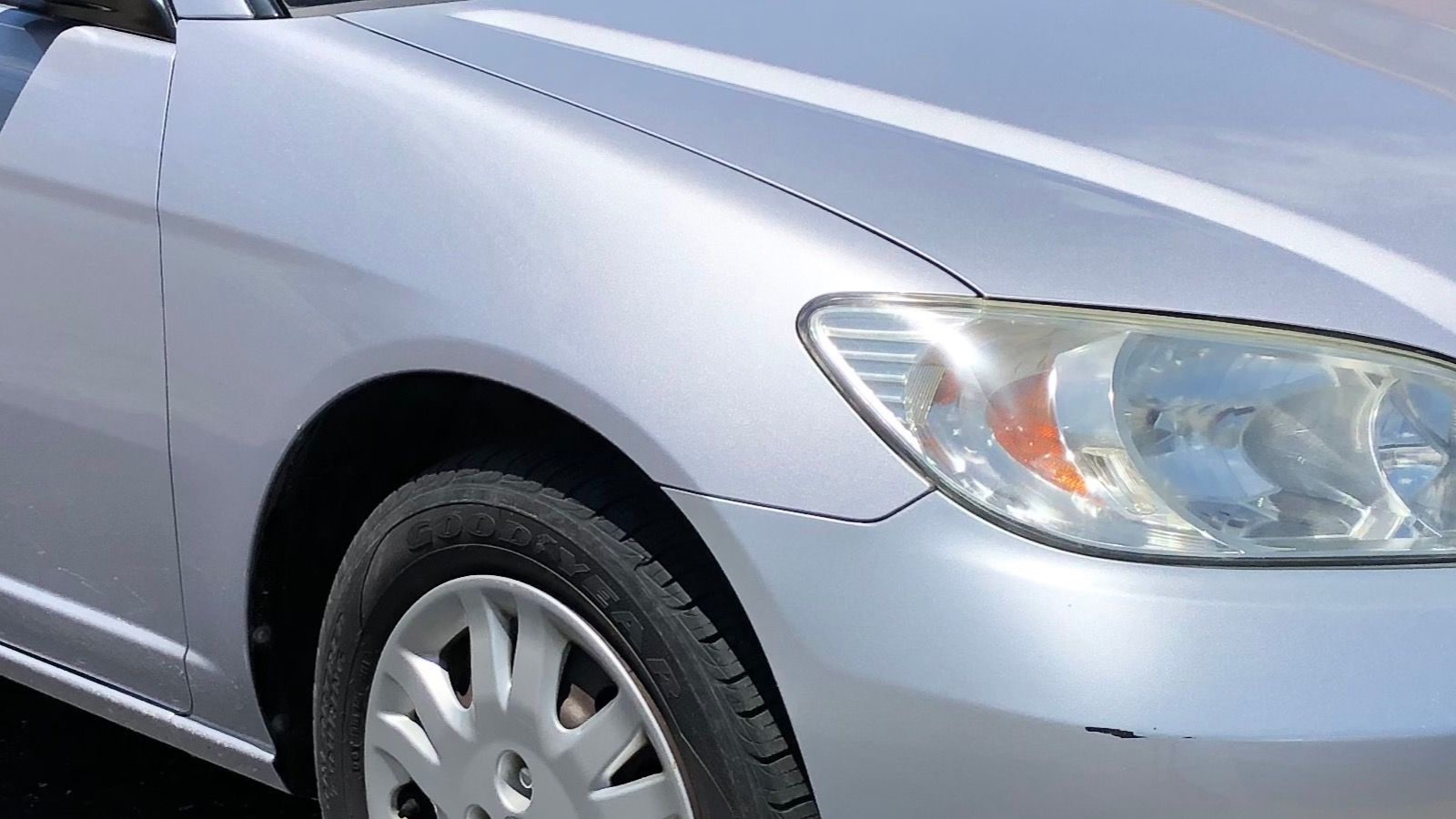 2004 Honda Civic, EP/ES seventh generation — silver coupe, front three-quarter view