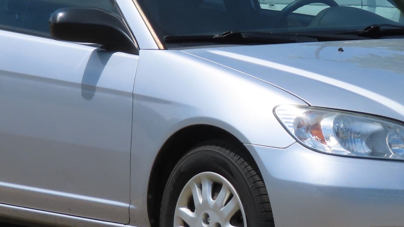 2005 Honda Civic — silver coupe, front three-quarter view