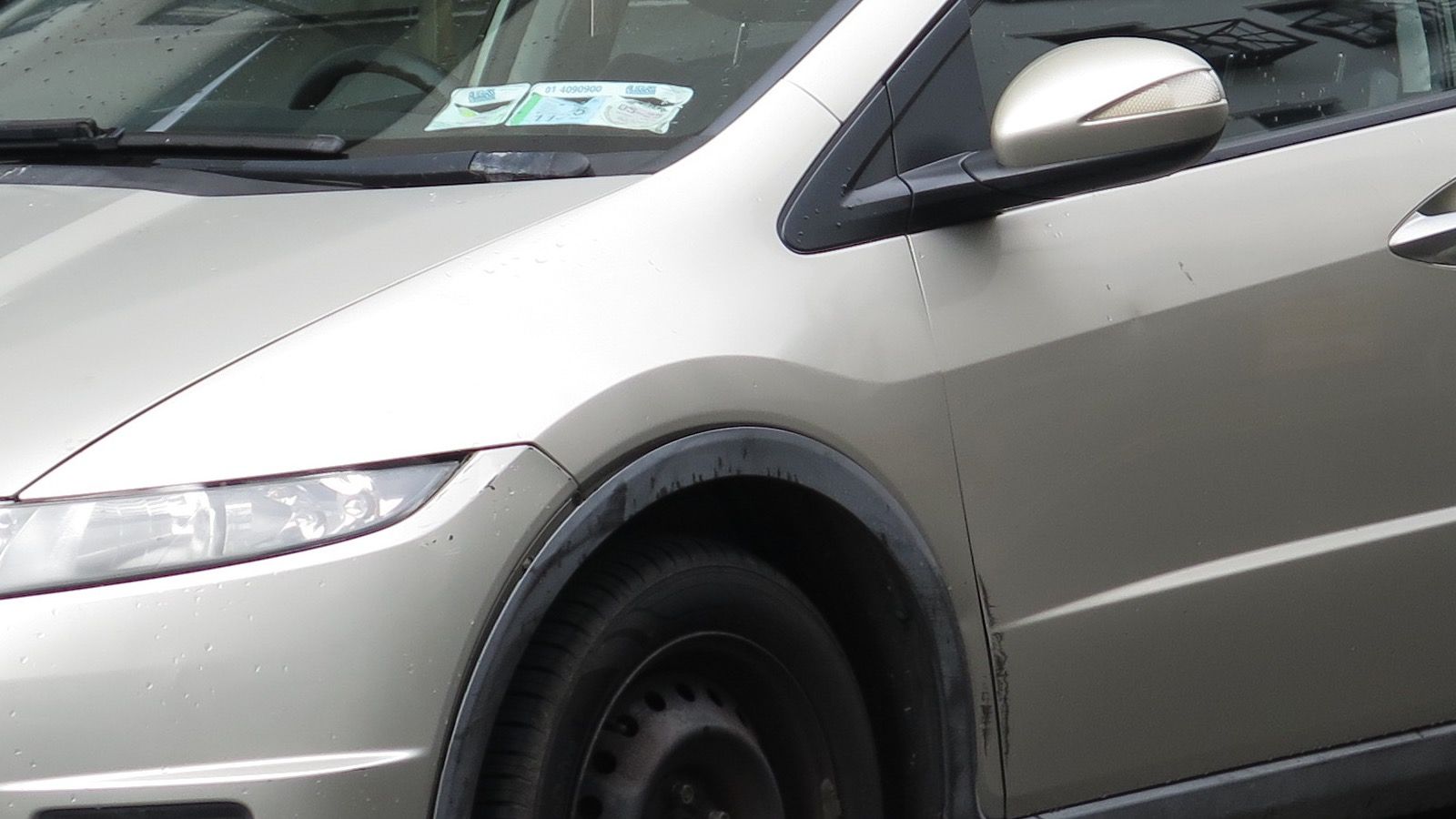 2008 Honda Civic — gray hatchback, front three-quarter view