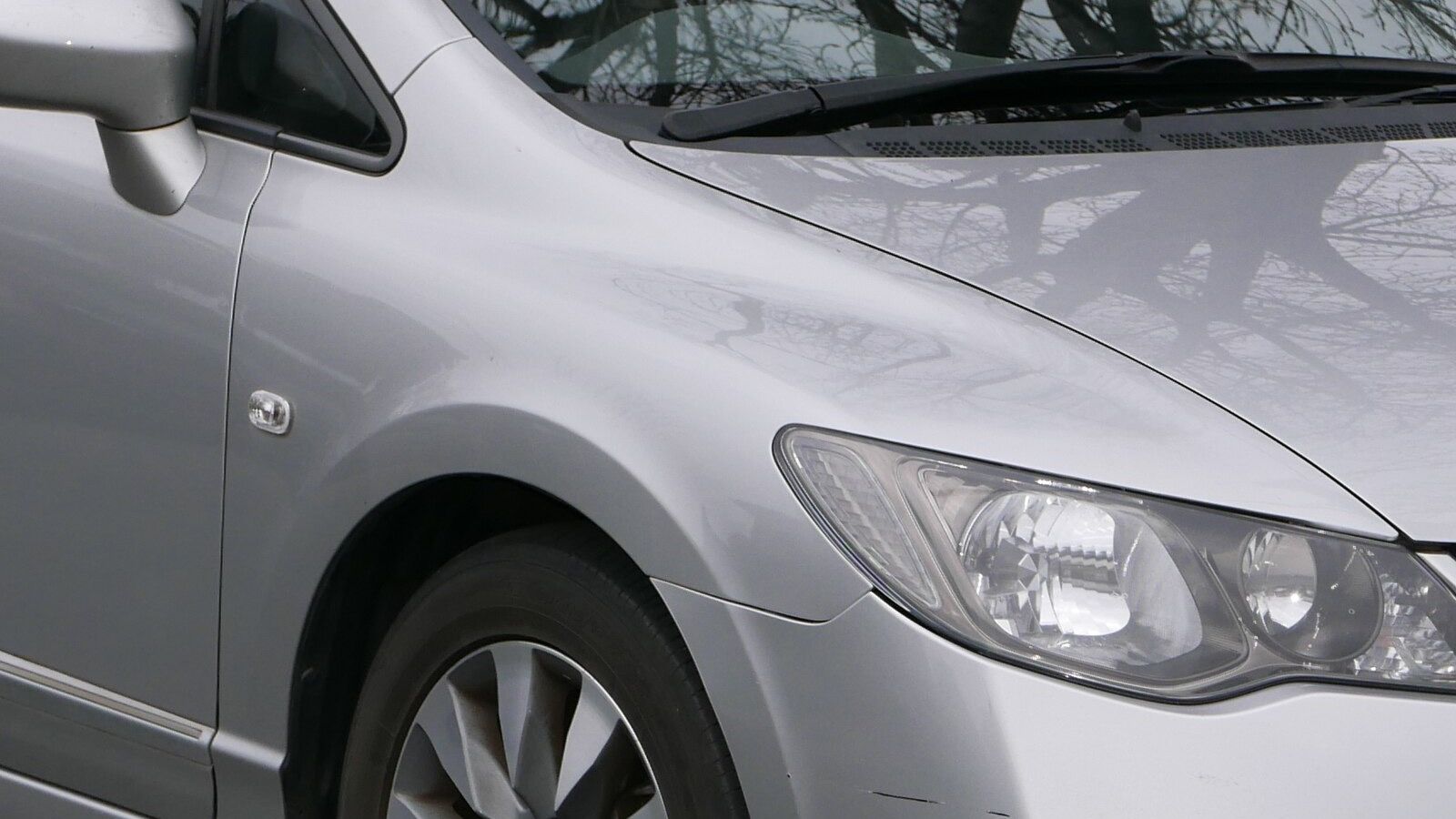2010 Honda Civic — silver sedan, front three-quarter view