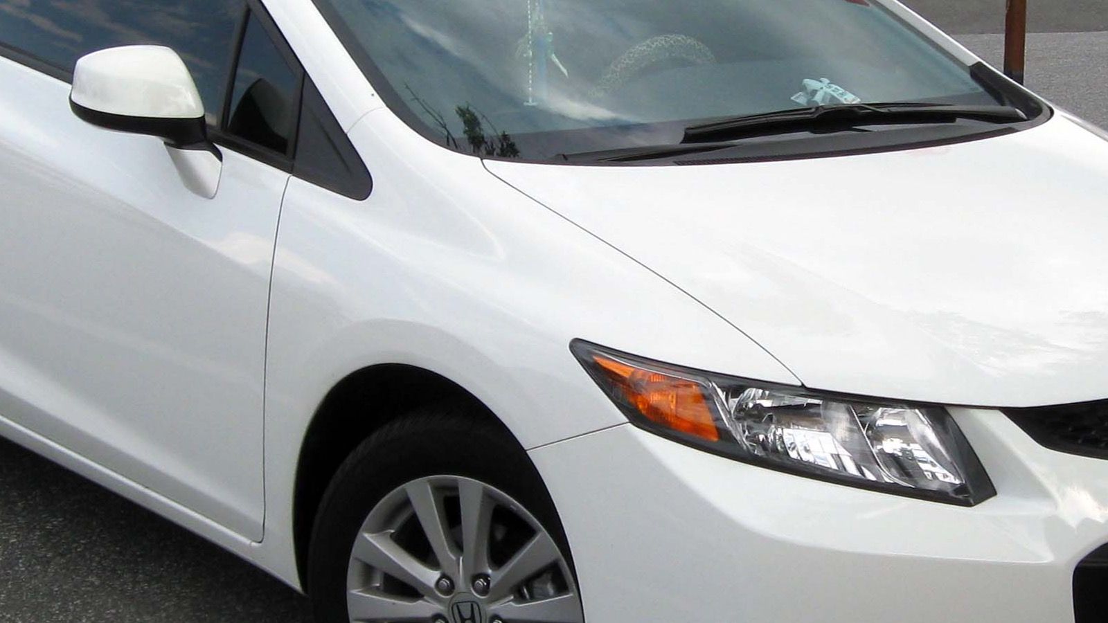 2011 Honda Civic — silver coupe, front three-quarter view